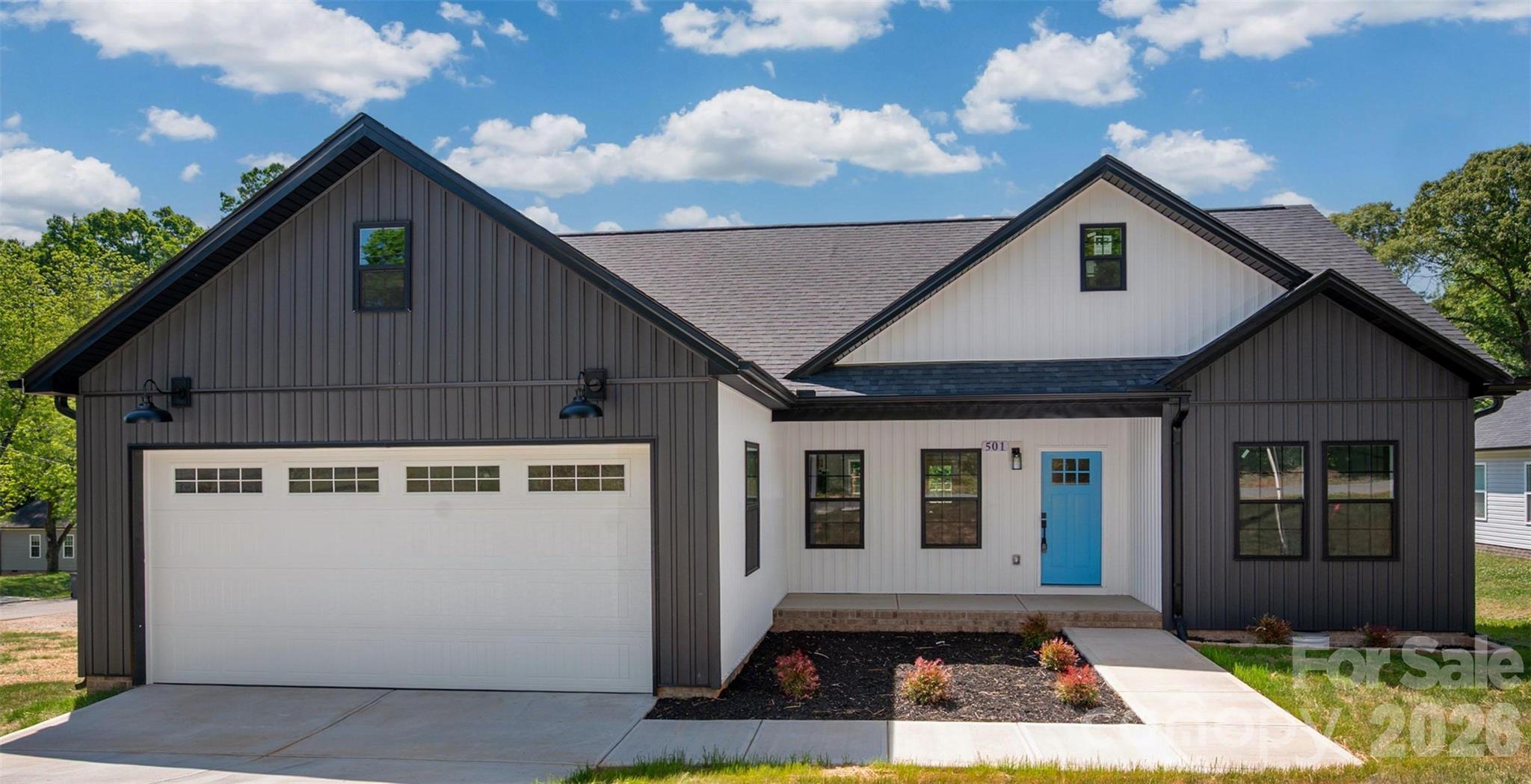The modern farmhouse you’ve been waiting for has arrived! This quality-built new construction home sits on a generous corner lot (approximately 1/3 acre) less than 3 miles to bustling downtown Kannapolis. This exceptional property is truly a rare find, including a spacious 2-car attached garage and a 2-car detached garage/workshop. The large deck and wide front porch are perfect for enjoying the outdoors.

Step inside the open-concept layout to find a caliber of finishes and attention to detail rarely seen at this price point, including soaring ceilings, abundant natural light, upgraded matte black fixtures throughout, custom closets, craftsman trim, upgraded hardware, recessed lighting, and all hard flooring (no carpet).

The massive great room flows seamlessly into a showstopper kitchen with upgraded cabinets, high-end appliances, a walk-in pantry, and a huge island—ideal for modern living and entertaining.

The private primary bedroom with en-suite is a true oasis with its large walk-in shower and separate water closet. This home is ready for immediate occupancy and qualifies for up to 1% in lender credits to be used for closing costs or rate buy down through Atlantic Bay Mortgage. Schedule your showing today!