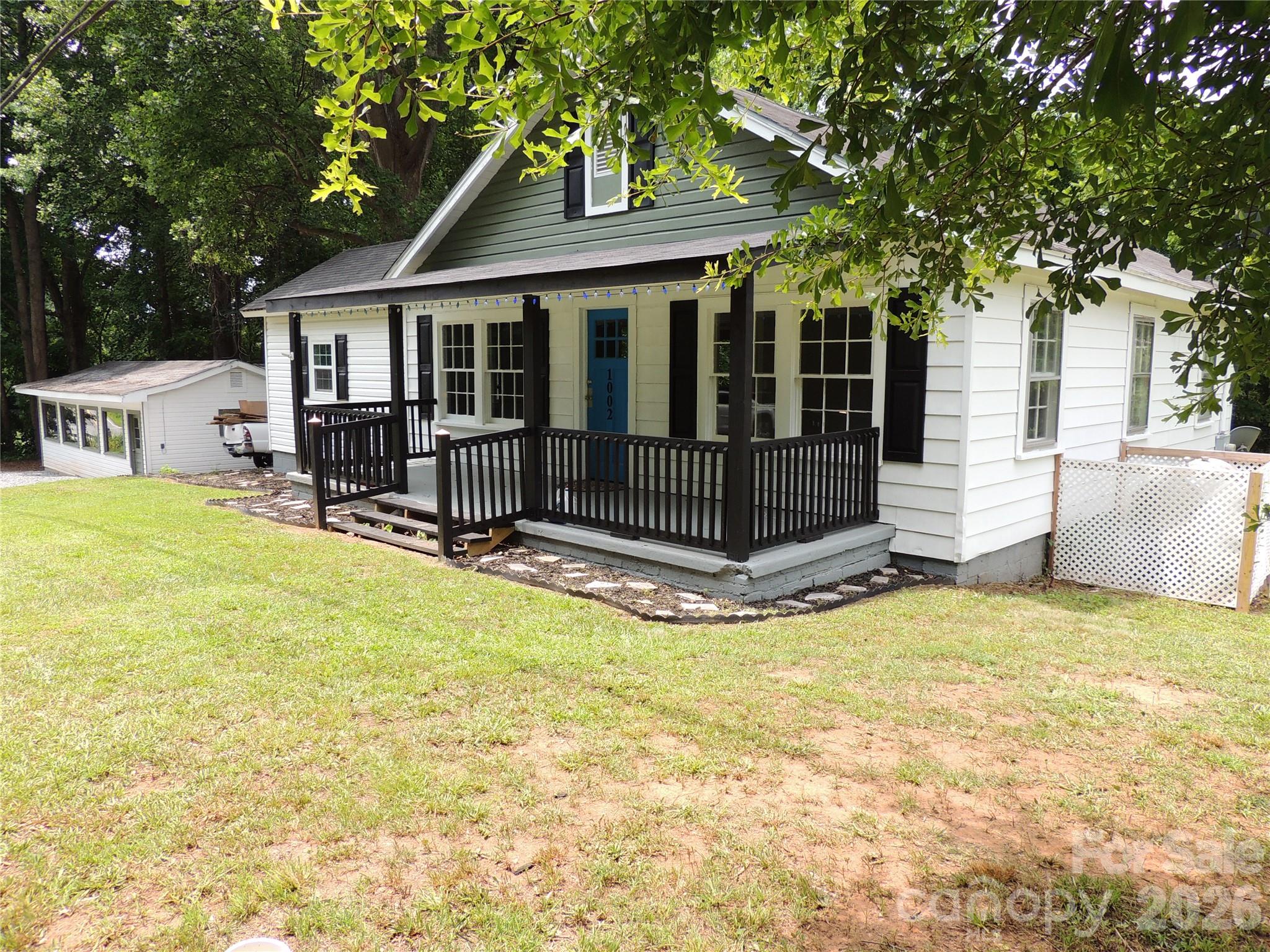 Charming "1920" 3 Bedroom 1 Bath Cottage Style Ranch on 0.77 ac lot in city limits has Open Floor Plan, Covered  Front Porch and Open Rear Deck. Freshly Painted inside and out. Vinyl Windows, New Floor Covering and Carpet and an amazing 800 SF Workshop that can be used for home business, storage or extra playroom. Extra Storage in a Basement Room. This lot is large enough for ADU or Tiny Home in the Back Yard. This Home has many possibilities and is only 5 minutes away from everything.  Being Sold As Is.