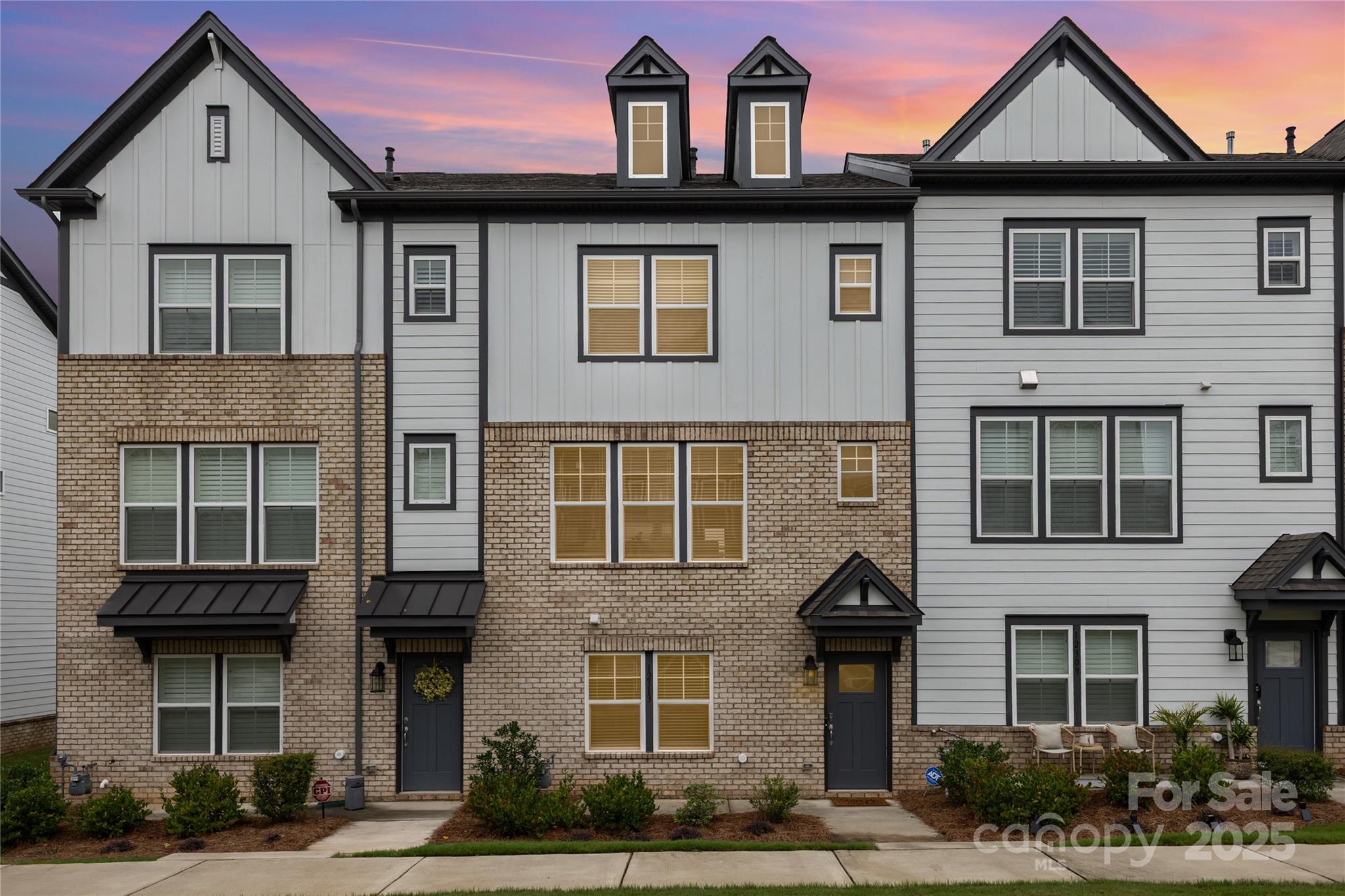 $7500.00 IN SELLER CONCESSIONS!!  Stunning luxury townhome built with numerous upgrades in Ballantyne East. It blends contemporary finishes with a highly functional layout designed for comfort and convenience. The entry level features a private guest suite or home office with its own full bath and direct access to the 2-car garage. Upstairs, enjoy an open-concept main living area with high ceilings, luxury flooring, and abundant natural light. Pre-wired for surround sound in the family room. The gourmet kitchen boasts granite countertops, stainless steel appliances, beverage center, a gas range, upgraded cabinets, tile backsplash, and a large center island—perfect for entertaining. Step outside onto the spacious balcony to relax or dine outdoors. On the top floor, you’ll find 2 luxurious primary suites with a walk-in closets and spa-like baths. Located in Ballantyne East, this home is close to Stonecrest Shopping Center, Village at Robinson Farm, and Ballantyne Bowl.