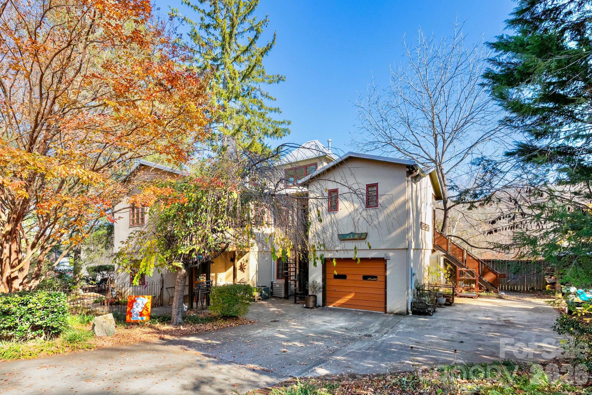 Is this the most interesting property available in Asheville? Even without the eclectic furnishings (some of which are available), the unique and versatile layout lends itself to a variety of uses: single-family, multifamily, rental, live/work, artist studio, retail/commercial, or a mix. Zoning is the rare and coveted Neighborhood Business. So many extraordinary touches and endless customizations make it special, showing the high quality and thoughtful design. The studio apartment is being left fully furnished/turnkey and has been a reliable rental at $1800+ per month. Second floor living area has been rented for $2600+ per month. The first floor live/work space is also being prepared for rental which will bring in additional revenue. Amazing location in a friendly neighborhood in between Charlotte St and Merrimon Ave and just a mile to downtown. 3 bedrooms, 4 bathrooms, 3 kitchens, plus a bonus loft at the top! City confirmed that homestay short term rental STR possibility with two of the units with minor modifications if you live in the third. Sellers explored connecting the first and second floors to make it a more traditional two-story home but preferred the current layout so that hasn't been done but is possible according to the sellers and the City. It is well built and well-maintained. Provide proof of funds or preapproval letter with showing request. Check out the 3-D walk-through to get a sense of the layout and efficient design. Sellers are willing to consider owner financing - make an offer!