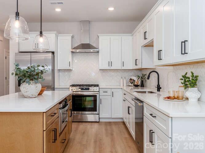Just minutes from Uptown, this beautifully designed Enderly Park townhome offers a rare combination of modern luxury, thoughtful design, and unbeatable convenience. Qualified buyers may be eligible for 100% financing with no PMI plus up to $20,000 in lender assistance that can be used toward closing costs, rate buy-downs, or loan amount reduction.

One of only four thoughtfully crafted residences on a quiet stretch of Elon Street, this home delivers the perfect balance of privacy and connected city living. Enjoy being moments from Enderly Park’s growing collection of popular restaurants, local breweries, coffee shops, and the community-driven events at Front Porch Charlotte.

Inside, clean architectural lines and elevated finishes create a sophisticated yet welcoming atmosphere. The open-concept floor plan is designed for effortless entertaining and comfortable everyday living, with seamless flow between the living, dining, and kitchen areas. The stylish kitchen features a gas range, modern finishes, and carefully selected design details that elevate the entire space.

Step outside to your own private, fully privacy-fenced backyard retreat, complete with a gas line hookup — ideal for grilling, entertaining guests, or enjoying quiet evenings under the Carolina sky. Every detail throughout the home has been curated to offer a polished, low-maintenance lifestyle with timeless appeal.

Positioned in one of Charlotte’s most exciting and fast-growing neighborhoods, this home combines peaceful surroundings with quick access to Uptown, making it an exceptional opportunity for buyers seeking both style and location.

Sophisticated design. Prime location. A home that feels effortlessly elevated.