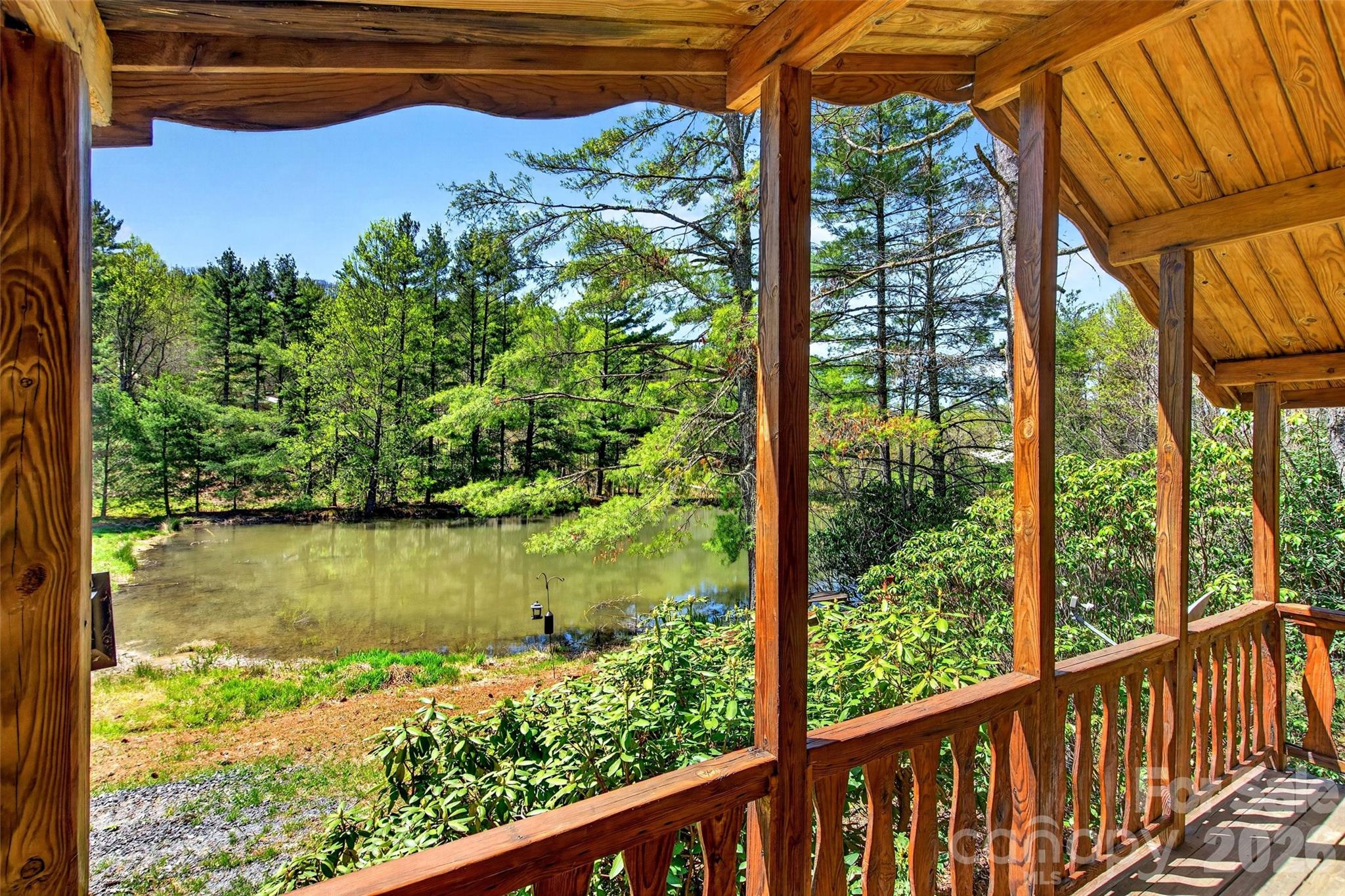 Tucked away in the mountains near Spruce Pine, NC, this charming cabin retreat offers privacy, serenity, and stunning natural surroundings on approximately 3.17 acres featuring beautiful ponds and peaceful mountain land.
The cabin features 1 bedroom, 1 bath, and an open-concept great room designed for comfortable mountain living. The inviting front porch overlooks the ponds and picturesque property, creating a peaceful setting to unwind and enjoy the sounds of nature.
Located just off the Blue Ridge Parkway near the Orchard at Altapass, this unique property offers the perfect mountain escape, vacation rental opportunity, or private retreat. Rarely do properties with this much natural beauty, water features, and mountain charm become available in such a desirable location. 

The adjoining main house property with 2.41 acres is also available for purchase for $330,000 - MLS #4380420, allowing buyers the option to own both properties together for the ultimate mountain getaway or multi-generational retreat for $549,000.  See MLS #4372351 - Both properties will share the spring water and driveway access to the main road.