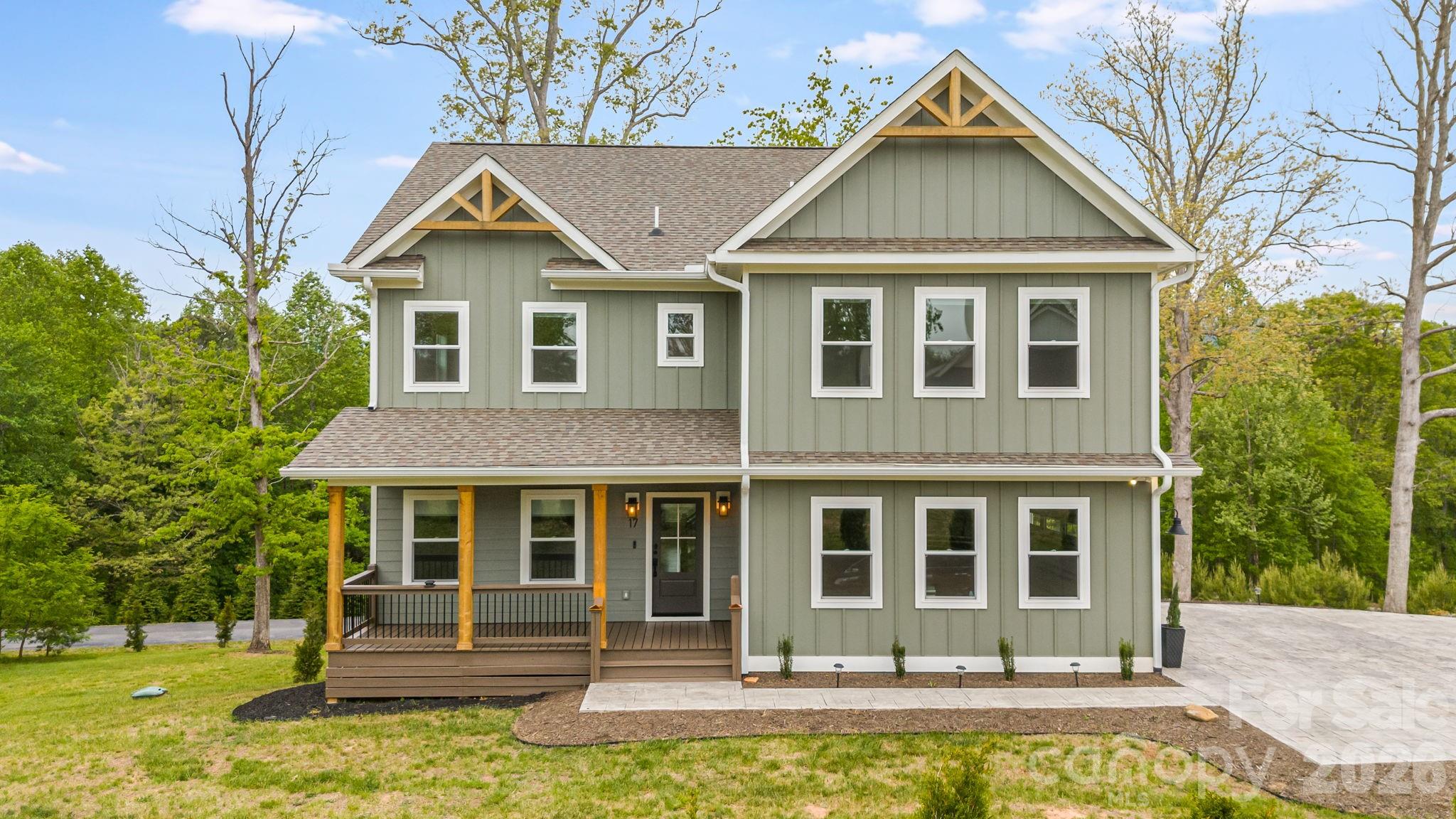 Close to Asheville yet surrounded by nature, this home is in the small, luxury neighborhood of Baxter Woods. The floor plan is open and spacious, with dedicated office space and a guest bedroom on the main level. The kitchen features a six-burner gas range, pot filler, and hood vent, opening to a bright, open living area. Mountain views give it a treehouse feel that never gets old.
The upstairs bedrooms are generously sized, with laundry on the upper level. The primary bath offers a two-person shower and oversized walk-in closet.
Downstairs, a finished walk-out basement includes a kitchenette and flex room/fifth bedroom, ready for multi-gen living or a short-term rental. The open downstairs living area boasts an alcove perfect for a home gym or media room. The 2-car garage is EV-ready. Structural warranties run through 2030, appliance coverage through 2028.
Some photos have virtual staging elements.