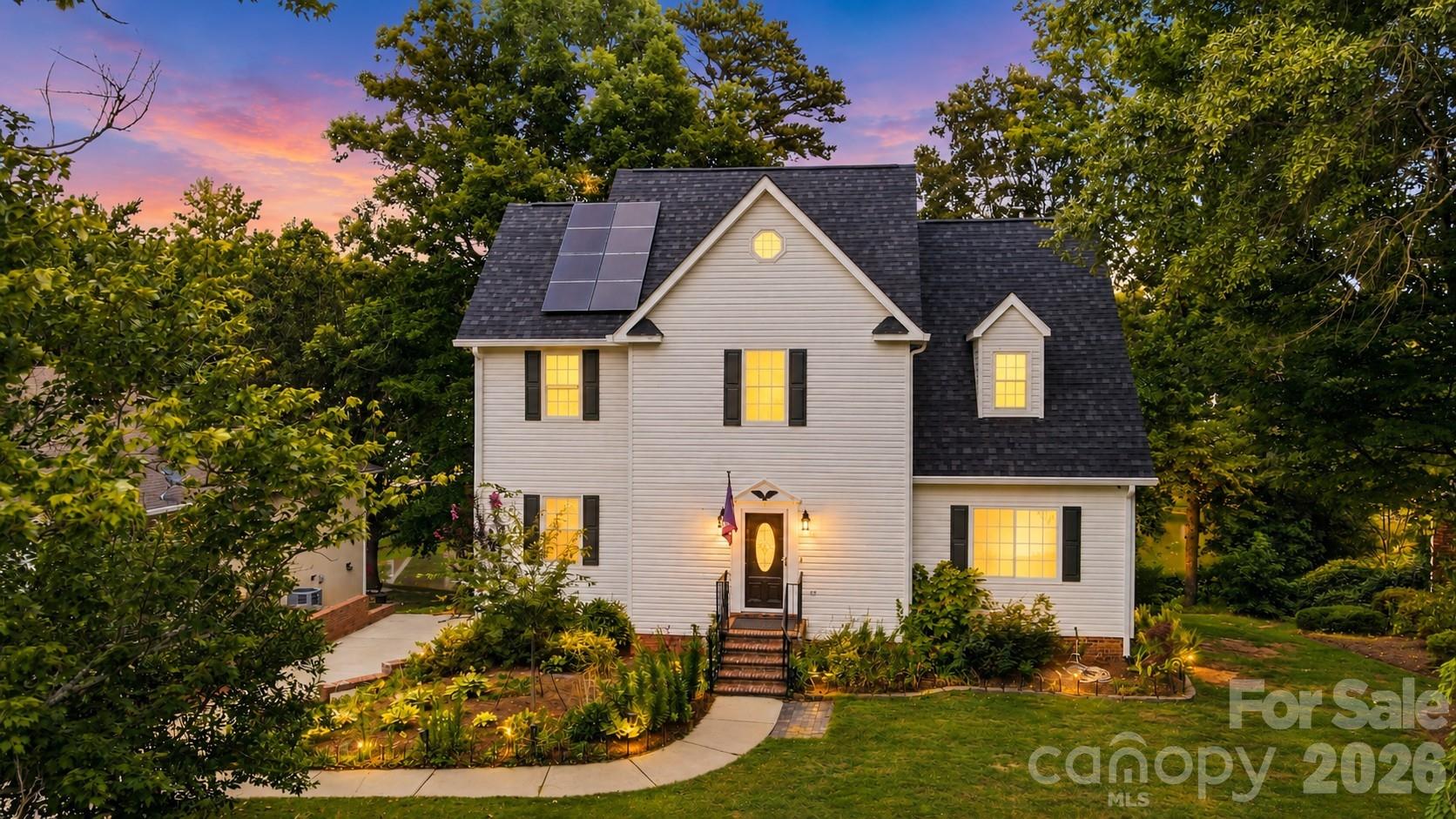 Rare opportunity to own a two-story basement home with a 3 car garage and beautiful water views! Tucked away on a quiet cul-de-sac, this spacious 4BR/3.5BA home offers exceptional features rarely found at this price point. Rich hardwood floors flow throughout much of the main level, highlighted by a dramatic two-story great room with fireplace. Separate, elegant formal dining room. The well-appointed kitchen features 42" cabinetry, granite countertops, designer tile backsplash, newer LG stainless appliances including a double oven, and a sunny breakfast area. The main-level owner's suite offers a large walk-in closet and a beautifully appointed bath with dual vanity, soaking tub, and oversized walk-in shower with dual shower heads. It also has access to laundry room. Step onto the rear deck and enjoy peaceful water views. Upstairs, a private bedroom with ensuite bath and walk-in closet serves as an ideal second owner's suite or guest retreat, while two additional spacious bedrooms share a full bath on the opposite side of the home. The finished walkout basement provides an expansive family room or recreation area, abundant storage, and direct access to an impressive paver patio featuring a Phelps Therapeutic Swim Spa (2023). Major updates include Roof (2024), Solar Panels with Tesla Backup (2023), HVAC (2021 & 2015), Furnace (2026), Replacement Windows (2024) and Gutters & Leaf Guards (2022). A truly exceptional home combining space, updates, and an outstanding setting.