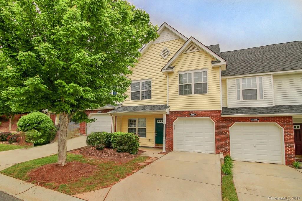 Move right in!  New and improved townhome has been updated with NEW carpet, NEW 12"x 24" ceramic tile kitchen flooring, fresh paint throughout, and some NEW lighting!  Portrait Homes' Cambridge floor plan features a dramatic two story family room, spacious living/dining area, two nice secondary bedrooms,  and oversized master BR with vaulted ceilings.  Rear patio backs to nice vista view of open common area.  Well located complex accessible to convenient lifestyle amenities.