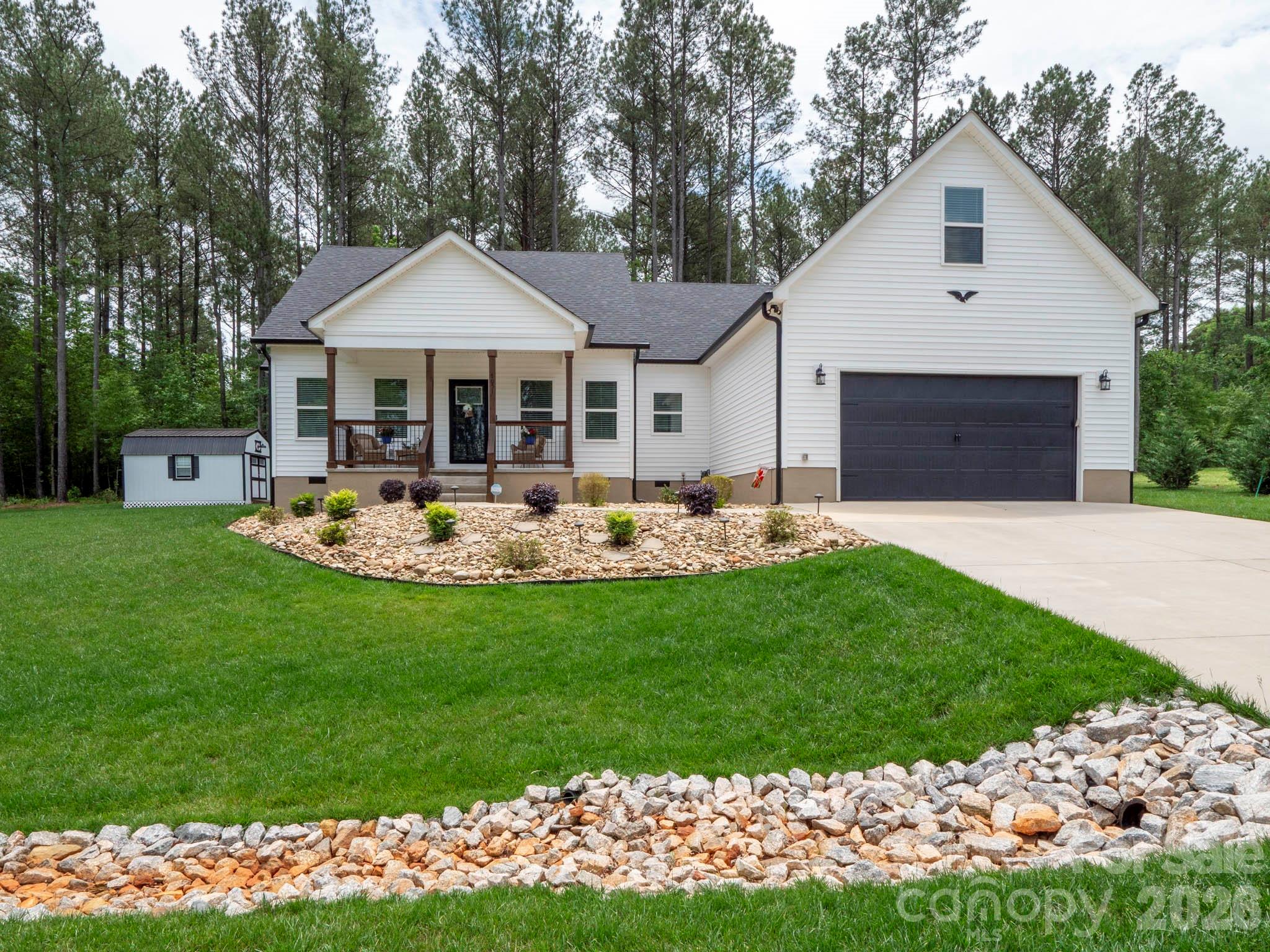 Built in 2023 and Better Than New! This beautifully maintained 2,360-square-foot home offers the perfect blend of modern design, quality craftsmanship, and thoughtful upgrades. From the moment you arrive, you'll appreciate the attractive curb appeal enhanced by low-maintenance river rock landscaping and the pride of ownership evident throughout.

Inside, the spacious floor plan is filled with natural light and designed for both comfortable everyday living and effortless entertaining. The home's modern construction provides the benefits of energy efficiency, contemporary finishes, and peace of mind that come with newer construction.

Additional upgrades set this property apart, including a professionally epoxied garage floor and generator-ready electrical setup, offering added convenience and preparedness. Outside, a detached 12' x 16' building provides excellent flexibility for storage, a workshop, hobbies, or recreational use.

Move-in ready and thoughtfully upgraded, this exceptional home offers the opportunity to enjoy the advantages of new construction without the wait. Conveniently located and meticulously cared for, this is a property you won't want to miss. Schedule your private showing today and experience all this outstanding home has to offer.