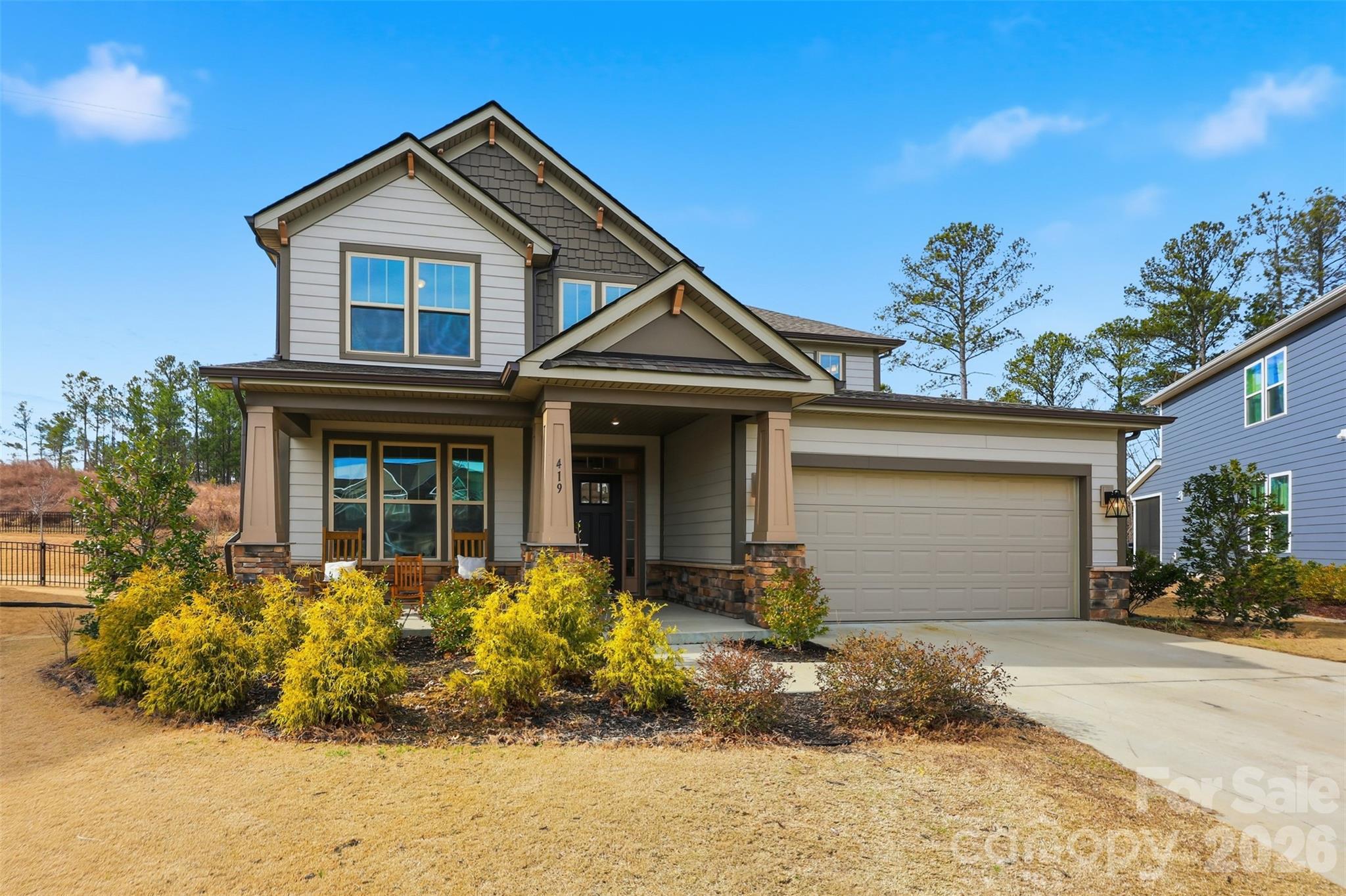 Welcome home to 419 Clemson Tree Lane, a beautifully designed 4-bedroom, 3.5-bath residence tucked away on a quiet cul-de-sac in the desirable Paddlers Cove community of Clover, SC. This thoughtfully laid-out home offers the perfect blend of comfort, space, and convenience—just minutes from Charlotte and Charlotte Douglas International Airport.

The primary bedroom is conveniently located on the main level, providing a private retreat with an en-suite bath. Upstairs, additional generously sized bedrooms and bathrooms offer flexible space for family, guests, or a home office.

The open living areas are ideal for everyday living and entertaining, while the two-car garage adds both storage and convenience. Enjoy the peace and privacy of cul-de-sac living while still being close to shopping, dining, and major commuter routes.

Located in the sought-after Clover school district, this home delivers small-town charm with big-city accessibility. Don’t miss your opportunity to own a spacious, well-located home in one of Clover’s most welcoming neighborhoods.
