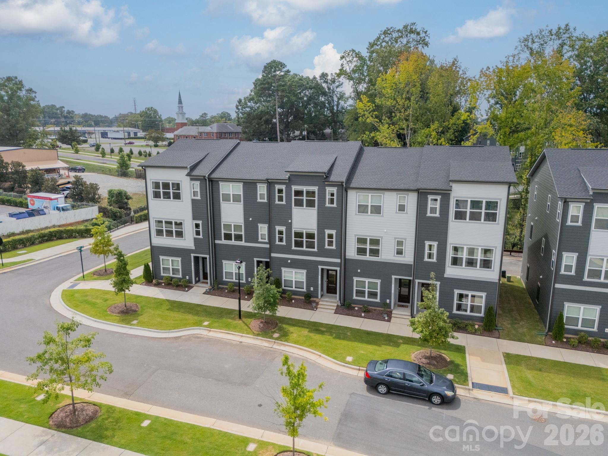 Discover sophisticated living at 2025 Evolve Way.  This beautifully designed 1,717-square-foot townhome is nestled in the one of the best spots in Oakhurst.  This home is backing a tree lined area that will not be developed, so you have privacy and foliage.  
The moment you enter, you'll be greeted by an inviting main level that includes a full bedroom and bathroom, offering incredible flexibility.
The heart of the home is on the second floor, where a breathtaking kitchen awaits. Imagine preparing meals in a space featuring soft-close cabinetry, Frigidaire Gallery 3-door fridge, and a generous island, all while enjoying peaceful views of the surrounding woods.
With 3 bedrooms and 3.5 baths, this home provides ample space and privacy. The expansive primary suite is a true retreat, boasting a large walk-in closet and a double vanity. Additional features like a built-in garage with EV charging compatibility and a modern all-in-one ventless washer/dryer elevate the everyday living experience.  You’re also a stone’s throw away from The Teal Turnip, Common Market, The Health Club, Mood House Spa and so much more.