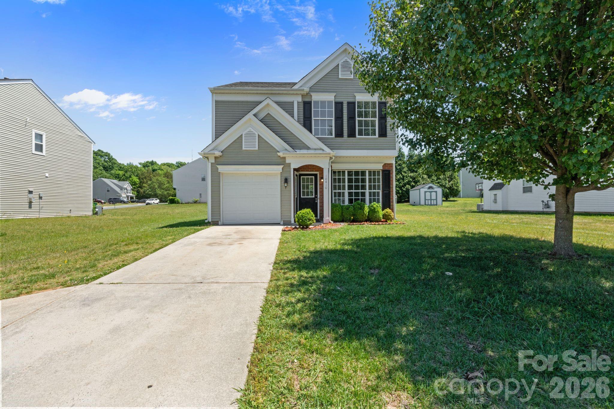 Welcome to 10410 Roundleaf Dr — a beautifully renovated 3-bedroom, 2.5-bath home offering approximately 1,500 sqft of stylish, move-in-ready living in a rapidly growing Charlotte location near UNCC. From the moment you step inside, you’re greeted by an open and airy layout filled with natural light, enhanced by higher ceilings and brand-new gleaming LVP flooring that flows seamlessly throughout the main level. The living space is anchored by a cozy accent fireplace and complemented by an updated modern light fixture, creating the perfect blend of comfort and design. The fully renovated kitchen is a true highlight, featuring granite countertops, freshly finished cabinetry with updated hardware, brand-new stainless steel appliances, and the added convenience of two pantry spaces for extra storage. Whether you’re cooking, entertaining, or just enjoying everyday living, this kitchen delivers both functionality and style. The main level also includes a convenient half bath and access to a single-car garage, offering practicality for daily living. Step outside to a flat, usable backyard — ideal for relaxing, entertaining, or creating your own outdoor setup. Upstairs, you’ll find three spacious bedrooms, including a large primary suite with vaulted ceilings that add an extra sense of openness. The primary bathroom features a double vanity, a beautifully tiled shower, and a generous walk-in closet. All bedrooms have been updated with modern light fixtures, and the secondary bathroom has been refreshed with a new vanity and lighting, giving the entire home a cohesive, updated feel. Located just minutes from UNC Charlotte, this home is perfect for first-time buyers, investors, or anyone looking to be in a high-demand rental and growth area. With easy access to shopping, dining, major highways, and everything Charlotte has to offer, this is a smart opportunity whether you’re looking for a primary residence or an investment property. Don’t miss your chance to own a fully renovated home in one of Charlotte’s most convenient and up-and-coming locations — schedule your showing today!