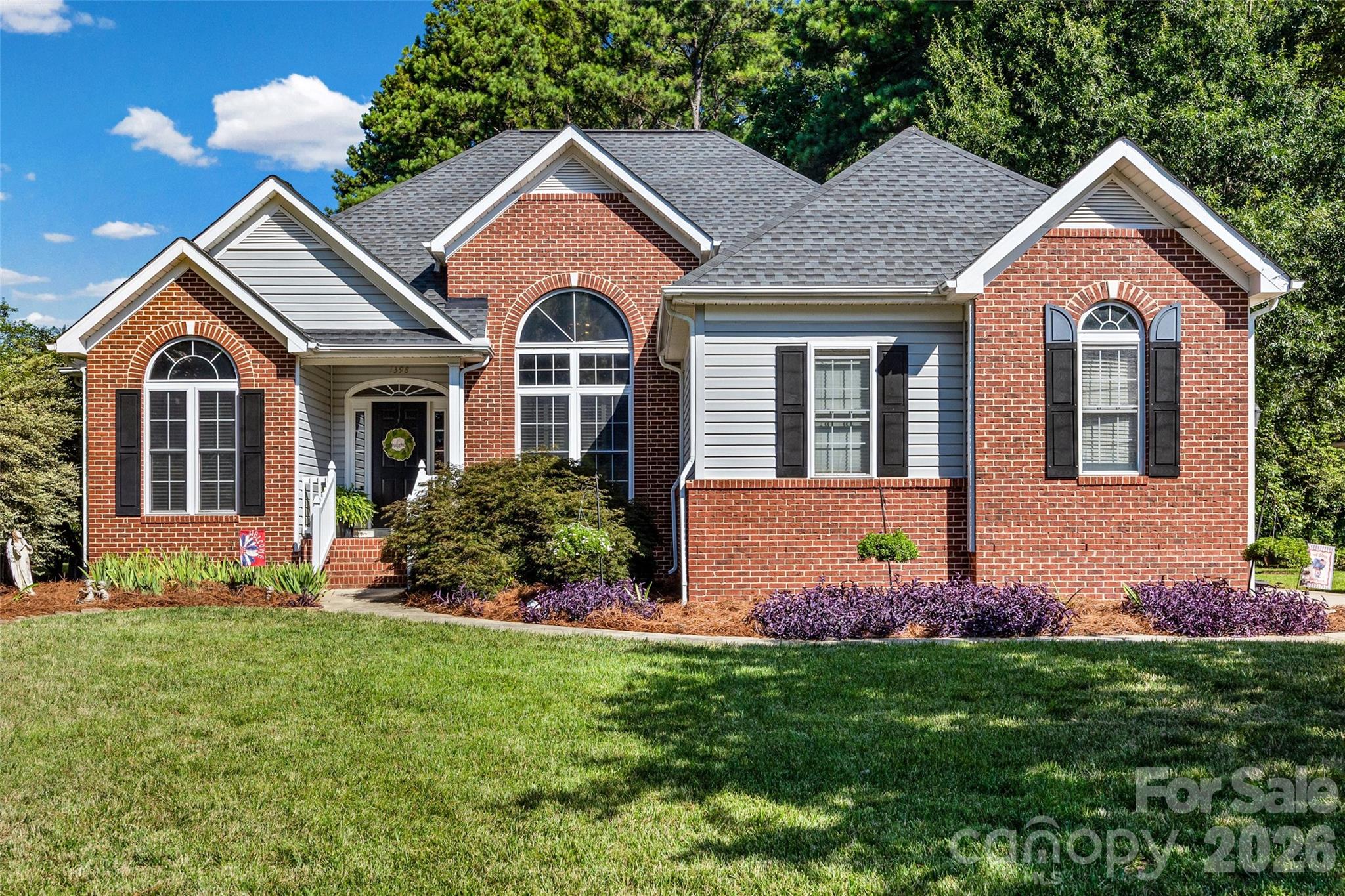 Welcome to 1398 The Crossing.  Charming 3-bedroom, 2-bathroom ranch home with stunning brick front and beautiful mature trees offering fantastic curb appeal. The spacious open layout includes a cozy living area with a vaulted ceiling and fireplace, and a stunning dining room filled with windows and gorgeous natural light on repeat, just perfect for entertaining. The kitchen features a built in island in the breakfast area, plenty of cabinet / counter space offering the perfect space for preparing family meals and gatherings.  The primary suite has a trey ceiling, sitting area, ensuite bath with garden tub and a large walk in closet.  The second bedrooms are on the other side of the home with a full bath separating the two.   Enjoy the two car garage with plenty of room for vehicles and storage, and an expansive back deck—ideal for outdoor gatherings and relaxation. Conveniently located to shopping, restaurants, and schools.  Freshly painted and move in ready.  Take a look at this one today!
