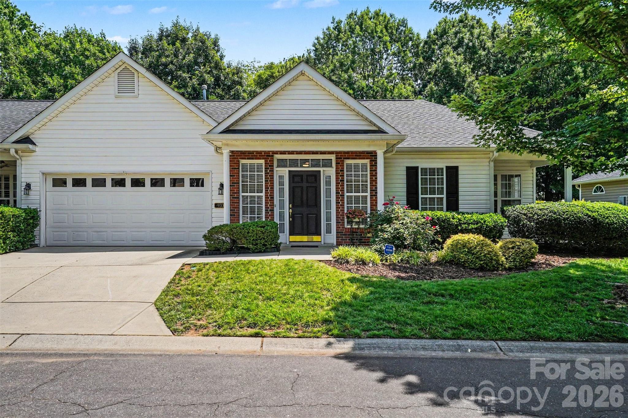 Beautifully updated single-level townhome in the highly desirable Southbrook Villas community. This inviting home features an open-concept layout with fresh interior paint, new flooring, updated lighting, and a modern kitchen complete with new quartz countertops and stainless steel appliances. The spacious primary suite provides tons of natural light and a generous sitting area or office nook.  The convenient ensuite features a double-sink vanity, and a large walk-in closet for exceptional comfort. Relax in the bright great room with a cozy gas fireplace, enjoy the oversized laundry room, and appreciate the benefits of an attached two-car garage. A private backyard adds the perfect touch of outdoor retreat. Community amenities include walking areas and salt water pool.  Dues also include trash service, water, and exterior maintenance. A truly move-in-ready home offering comfort, style, and low-maintenance living.