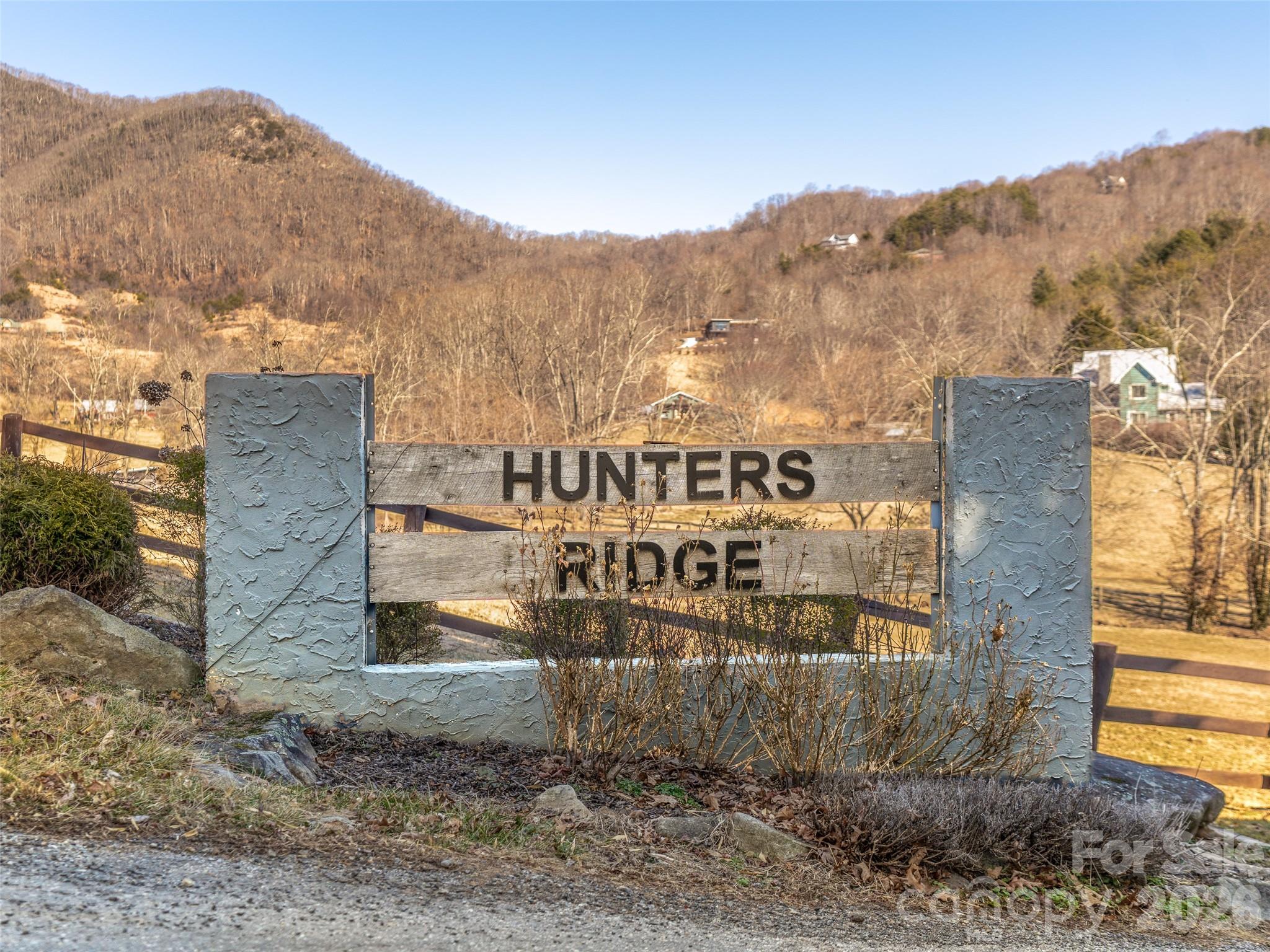 Located just 25 minutes from Downtown Asheville and 15 minutes from Downtown Canton, this 1.97-acre parcel in the quiet Hunter’s Ridge community offers an excellent opportunity to build your mountain home.
The property features a gently elevated, highly buildable knoll with expansive views and easy access from well-maintained neighborhood roads. A driveway could be easily installed through the center of the lot, and power is available.
If you’re looking for privacy, convenience, and a practical homesite with strong potential, this property is ready for your vision.