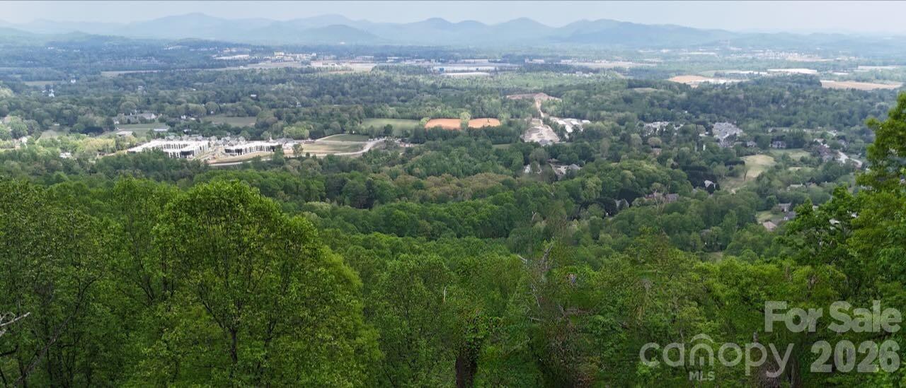 Build your dream home on this stunning 2-acre homesite in the gated High Vista community in Mills River, NC. Tucked away at the end of a quiet, dead-end street, this private, wooded lot offers the perfect blend of seclusion and natural beauty, with the potential for breathtaking long-range mountain views. Mature trees provide an ideal setting for a custom mountain retreat, while still allowing flexibility in your home design.
Located between South Asheville and Hendersonville, High Vista is a well-established mountain community known for its convenience and lifestyle amenities. Residents have the option to join the High Vista Property Owners Association, which features a clubhouse, swimming pool, tennis and pickleball courts, playground, and a welcoming community pub with indoor and outdoor dining. Optional membership to the Chestnut Mountain Golf Club offers access to an 18-hole course set against a scenic mountain backdrop.
Enjoy the peace and privacy of mountain living while remaining just a short drive to shopping, dining, breweries, Asheville Regional Airport, and I-26. Whether you're planning a full-time residence or a seasonal getaway, this exceptional homesite offers the perfect opportunity to bring your vision to life in one of Mills River’s most desirable gated communities.