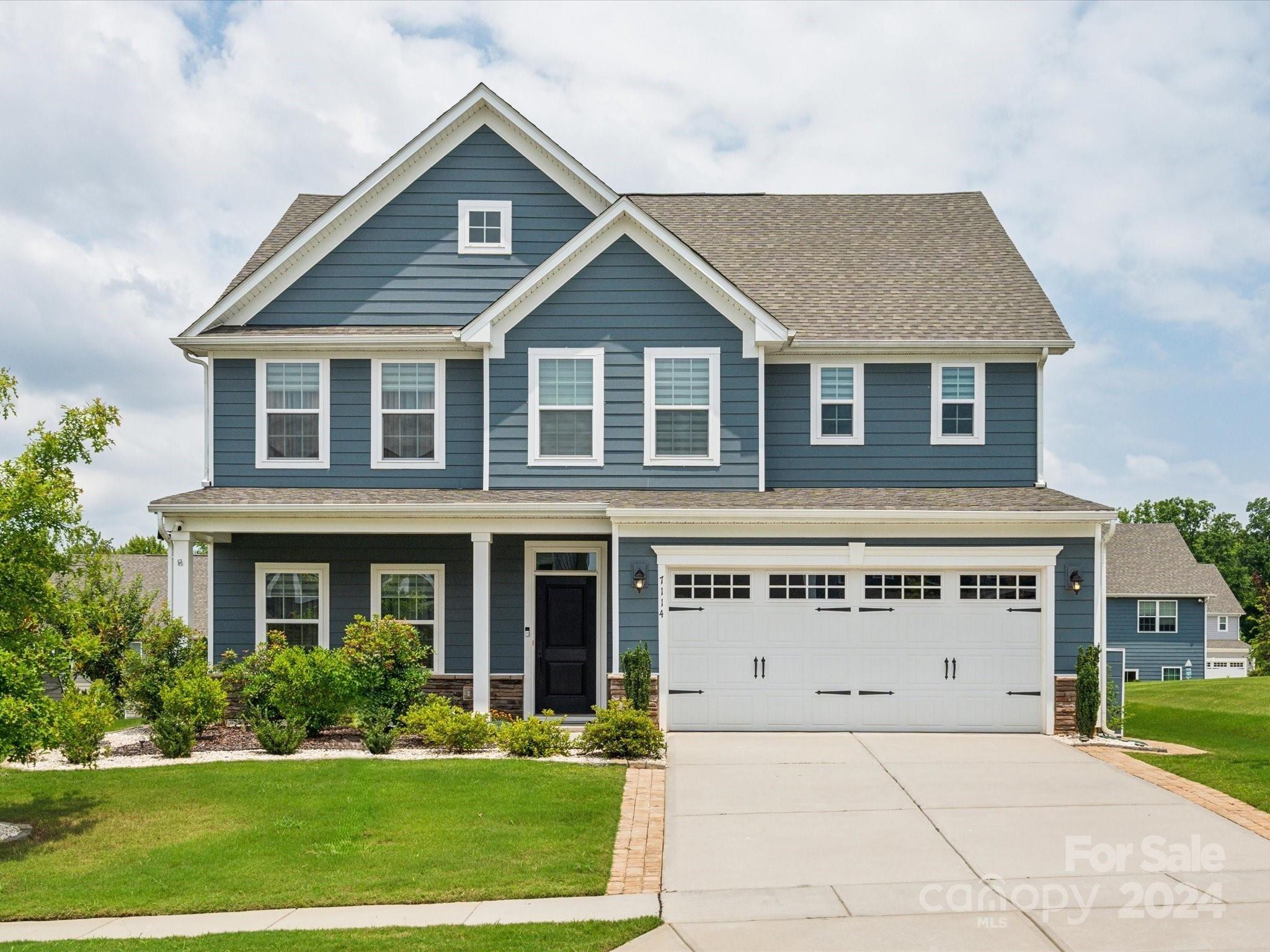 Immaculate move-in ready home in Ansley Park, Indian Land, offering a prime location just 15 minutes from Fort Mill, Ballantyne, and Blakeney! This home boasts an open floor plan with a guest suite downstairs with a full bathroom, and an enclosed office. LVP flooring, crown molding and neutral paint throughout the 1st floor, along with Nest thermostats with dual zoning. The spacious kitchen features 42" cabinets, tile backsplash, walk-in pantry, large  island, elongated sink, gas range and a second wall oven with a microwave combo built-in. The living area seamlessly connects, perfect for entertaining. The primary bedroom on the 2nd floor offers double walk-in closets and vanities, and a standing shower with an upgraded tankless water heater. A large covered patio in the backyard overlooks various fruit trees, grapevines, and berries. Community amenities include a pool, clubhouse, playground, and walking trails. All this, plus top-rated Indian Land schools. Schedule a showing today!