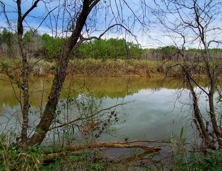 Looking for waterfront acreage?! AND a mountain view?! This is the lot for you.  Beautiful view overlooking the South Fork of the Catawba River and Spencer Mountain.  Conveniently located less than 10 minutes from I-85 and less than 30 minutes to Charlotte Douglas International Airport. So quiet that you would never believe you are that close to the city. Close to restaurants and nightlife in Belmont NC as well as large shopping areas like Franklin Square and Target/Starbucks off Cox Road Exit.
A septic permit (valid until 12/2027) has been approved by Gaston Environmental Health for 3 bedrooms, but the property may qualify for more.  Restrictions require a minimum of 1400 square feet to build. The waterfront area(about 1/2 acre) is 100-500 year flood fringe area. The proposed building area for the home is elevated well above that and has a view of the mountain also.

Septic Permit, Survey and Restrictions are available in MLS