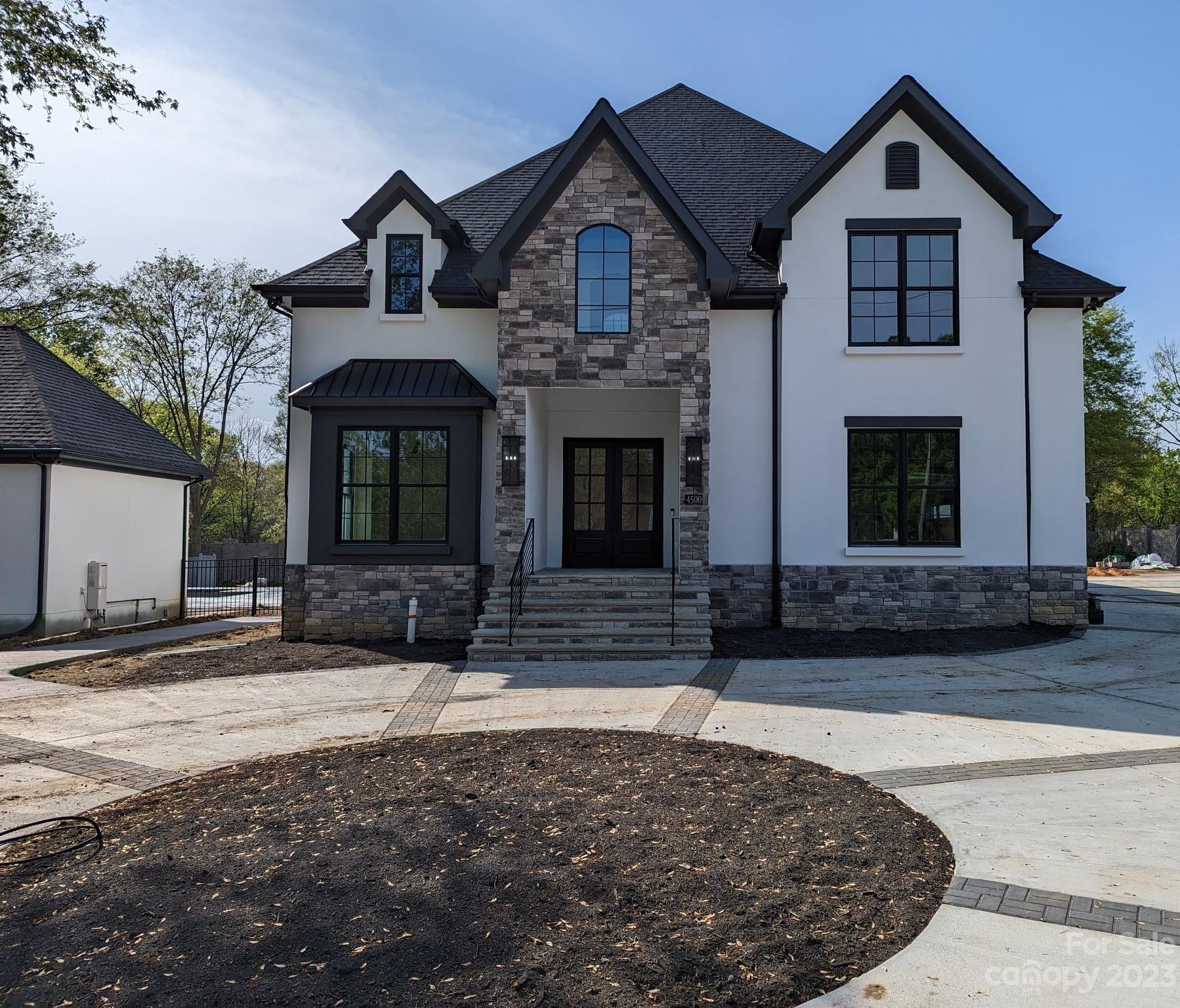 New Construction Modern Transitional Estate Home on 75 acres. Near Carmel Country Club. Main house 5BR, 7.5BA, 6317 sq. ft. Inground 18x36' Pool. 751 sq ft Pool House w/kitchen, FR, BA. 3 car Garage, circular Drive, extra parking. Open floor plan, 10 ft.ceilings main. Designer fixtures. Custom designer kitchen. Quartz counters. Wolf and Cove appliances, 48" builtin fridge. 10'Island w/counter seating, sep breakfast area. Butler's pantry w/wet bar, beverage cooler. Walk in pantry w/counters. FR w/gas fireplace. Large laundry/mudrm. Primary on main, luxury bath w/quartz counter, soaking tub, dual head shower, custom glass, great closet. Upstairs all BR have ensuite baths and walkin closets. 2nd laundry up. White oak flrs. Recessed LED lighting. Sound Break sheetrock. Insulated Interior walls. Fenced, front & back irrigation. Ring doorbell camera & 3 ring camera spot lights. 2 Rinnai tankless gas water heaters. Professionally landscaped. Prime Location. Broker is Developer/Owner of Home.
