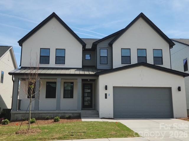 Homesite 30 showcases the highly desirable Logan floorplan with exceptional design details throughout. The impressive two-story great room features a fireplace and a 12’ rolling wall that opens to an outdoor living space, offering seamless indoor-outdoor connection. A main-level guest suite and a finished basement with a full bedroom and bath provide outstanding flexibility for guests or multigenerational living. The kitchen is thoughtfully designed with gas appliances, abundant cabinetry, and upgraded finishes. Additional highlights include French doors at the flex space, enhanced trim and flooring details, a loft with dedicated workspace, dual vanities in all full baths, a walk-in laundry with optional sink, and a large drop zone at the garage entry. The private primary suite offers a covered deck and spa-inspired bath with a freestanding tub—delivering comfort, functionality, and elevated style in one remarkable home. Located in the desirable Windell Woods community, this home combines functional design with contemporary appeal in a serene Tega Cay and Lake Wylie setting. Schedule a tour today!