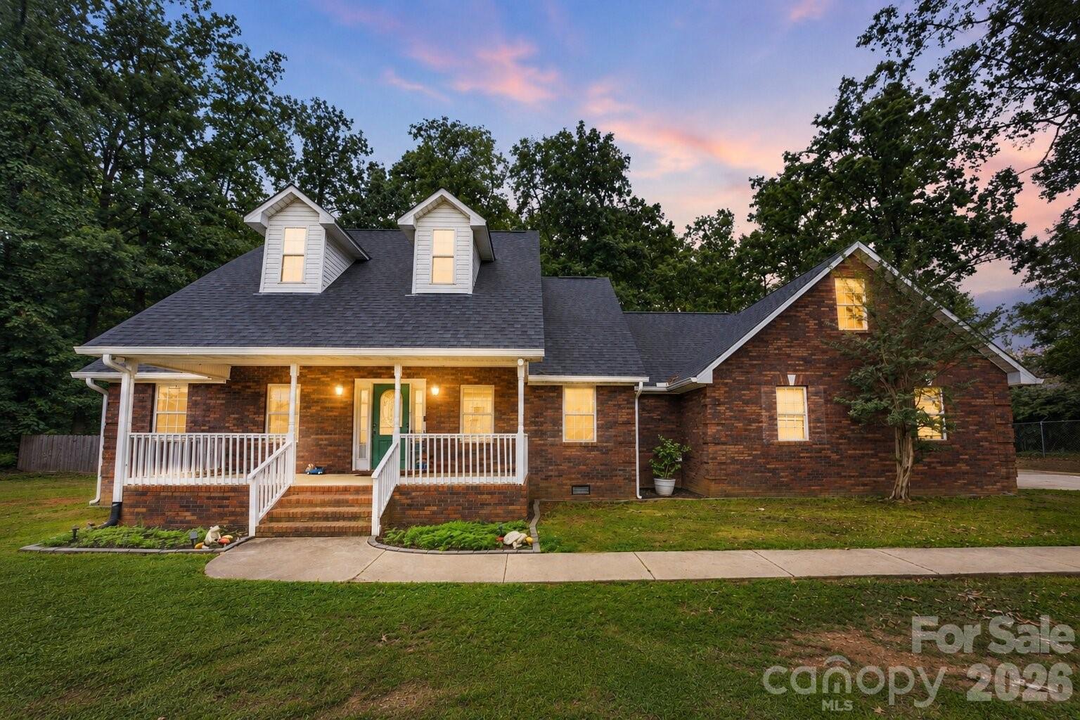 Welcome to 4403 Hubbard Road, a beautifully maintained home offering timeless curb appeal, major system updates, and a convenient North Charlotte location. Featuring a classic brick-accented exterior, inviting front porch, and mature landscaping, this property delivers the perfect combination of character, comfort, and functionality.

One of the biggest advantages of this home is the peace of mind that comes with a new roof and HVAC system installed in 2024, helping reduce future maintenance concerns and adding long-term value for the next owner.

Inside, you'll find spacious living areas filled with natural light, a functional floor plan, and flexible spaces ideal for everyday living, entertaining, working from home, or accommodating guests. The thoughtful layout provides comfort and versatility while maintaining a warm and welcoming feel throughout.

Step outside and enjoy the privacy this property provides. The backyard backs up to a wooded area, creating a peaceful natural setting and offering additional privacy with no immediate rear neighbors. Whether you're enjoying your morning coffee, hosting family and friends, or simply unwinding after a long day, the wooded backdrop creates a tranquil outdoor environment that's increasingly difficult to find in Charlotte.

Conveniently located approximately 15 minutes from Uptown Charlotte, this home provides easy access to major employment centers, shopping, dining, entertainment, healthcare facilities, and Charlotte Douglas International Airport. Northlake Mall, Concord Mills, University City, and numerous parks and recreation opportunities are all within a short drive.

Homes with major updates, privacy, and a desirable Charlotte location are becoming increasingly difficult to find. Whether you're a first-time buyer, relocating to the Charlotte area, upsizing, or looking for a long-term investment, this property presents an exceptional opportunity.

Highlights:
• New Roof (2024)
• New HVAC System (2024)
• Brick-accented exterior with excellent curb appeal
• Covered front porch
• Backyard backing to a wooded area for added privacy
• Spacious and functional floor plan
• Convenient access to I-77, I-85, and I-485
• Approximately 15 minutes to Uptown Charlotte
• Close to shopping, dining, healthcare, and entertainment
• Move-in ready with major system updates already completed