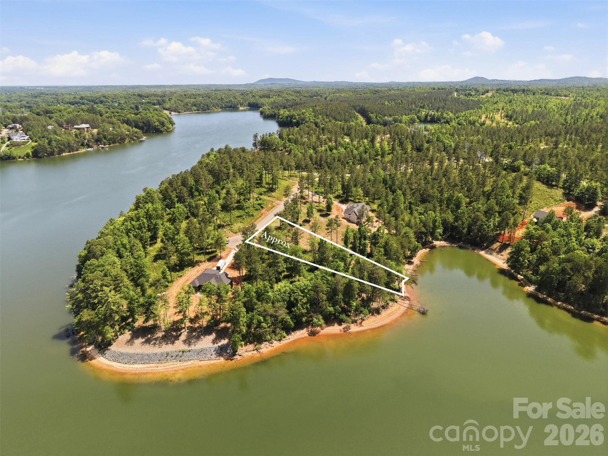 Discover the ultimate blend of luxury and nature at this stunning waterfront homesite, which offers the perfect canvas for your dream home within an exclusive gated community on the shores of Lake Rhodhiss. With a gentle slope leading to the water’s edge, you’ll enjoy breathtaking views and direct access to one of North Carolina’s most beautiful lakes. Imagine mornings spent watching the sunrise over the water, afternoons on the boat, and evenings entertaining with a backdrop of serene mountain and lake vistas. As a resident, you’ll enjoy resort-style amenities including a sparkling outdoor pool, recreation areas, walking trails, and private community spaces designed for relaxation and connection. Whether you’re planning a primary residence or a refined retreat, 3067 Jumping Run delivers the privacy, prestige, and lifestyle you deserve. Don’t just build a home—create your waterfront sanctuary. Water provided by Icard Township Water Corp (community system). Septic required.