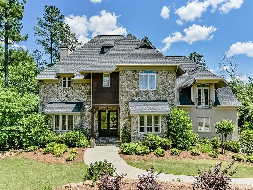 Stunning & elegant Country French estate home in exclusive upscale community. Formals, fireplace, gourmet kitchen w/gorgeous breakfast room, spacious bonus, 3 up bedrooms w/private baths, lg. master, 2 bedrooms on lower, area for media & rec rooms, covered porch & patio, lots of sq.ft. for other uses, wide hardwoods, stone, granite, travertine. New pool & pool house. Elegant decking on dual levels. Fabulous oversized garage on lower level workshop! Boat storage!