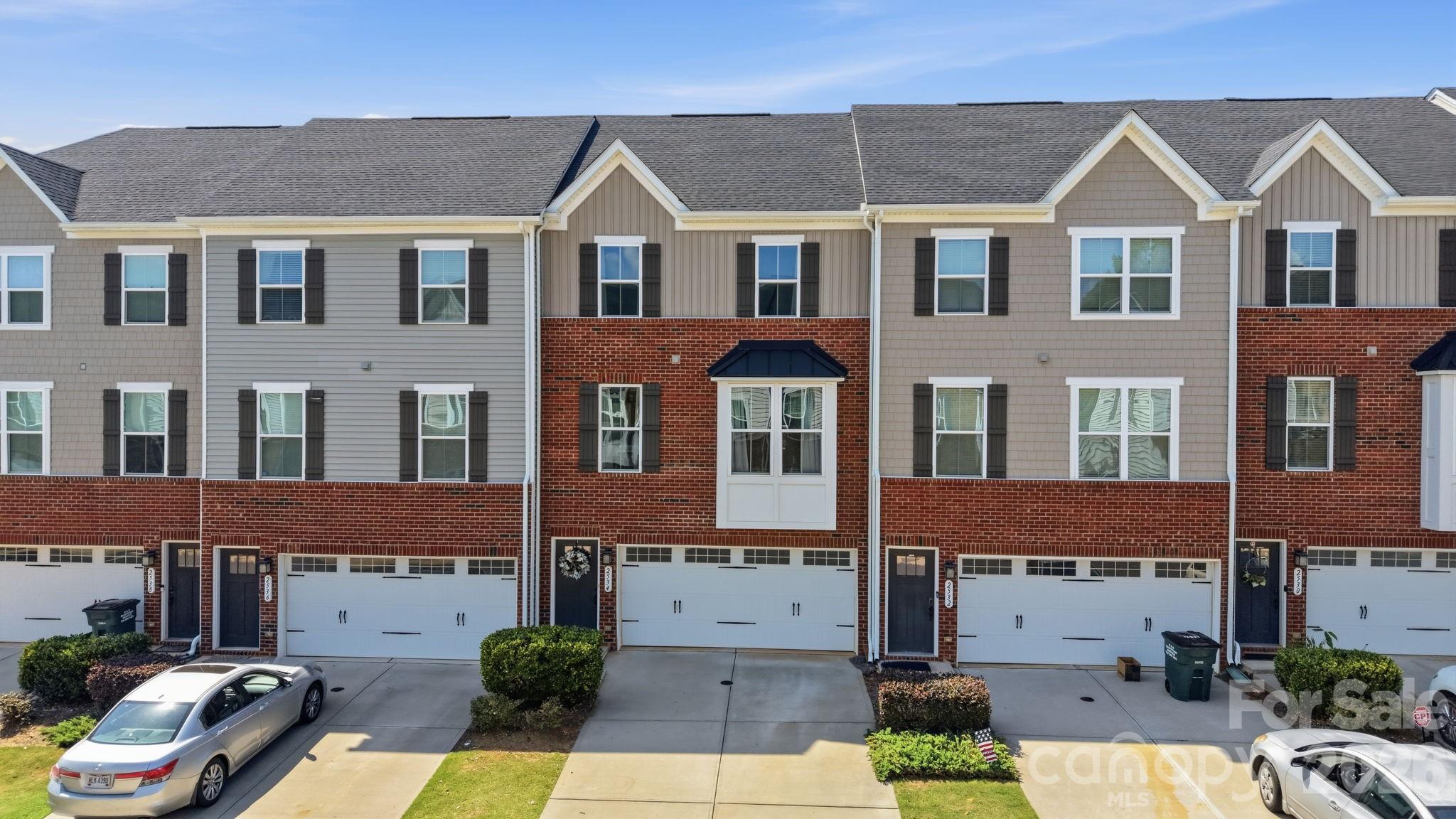 Welcome to this beautifully maintained townhome in the highly desirable Regent Park community of Fort Mill! Built in 2021, this spacious 3-bedroom, 2.5-bath home offers approximately 2,049 square feet of thoughtfully designed living space with modern finishes and an open-concept layout.
The main living level features a bright and airy family room that flows seamlessly into the chef-inspired kitchen, complete with a large center island, abundant cabinetry, stainless steel appliances, and a spacious dining area—perfect for everyday living and entertaining. Upstairs, the generous primary suite boasts a large walk-in closet and an en-suite bath with dual vanities and an oversized shower. Two additional bedrooms, a full bath, and a conveniently located laundry area complete the upper level.
The lower level provides additional flexible space ideal for a recreation room, home office, fitness area, or media room, along with direct access to the attached two-car garage. Enjoy low-maintenance living with access to Regent Park's outstanding amenities, including a community pool, tennis courts, walking trails, playgrounds, and green spaces.
Conveniently located just minutes from I-77, Ballantyne, shopping, dining, and entertainment, this home is also zoned for award-winning Fort Mill schools, including Sugar Creek Elementary, Springfield Middle School, and Nation Ford High School. Combining comfort, convenience, and an exceptional location, this move-in-ready home is one you won't want to miss.