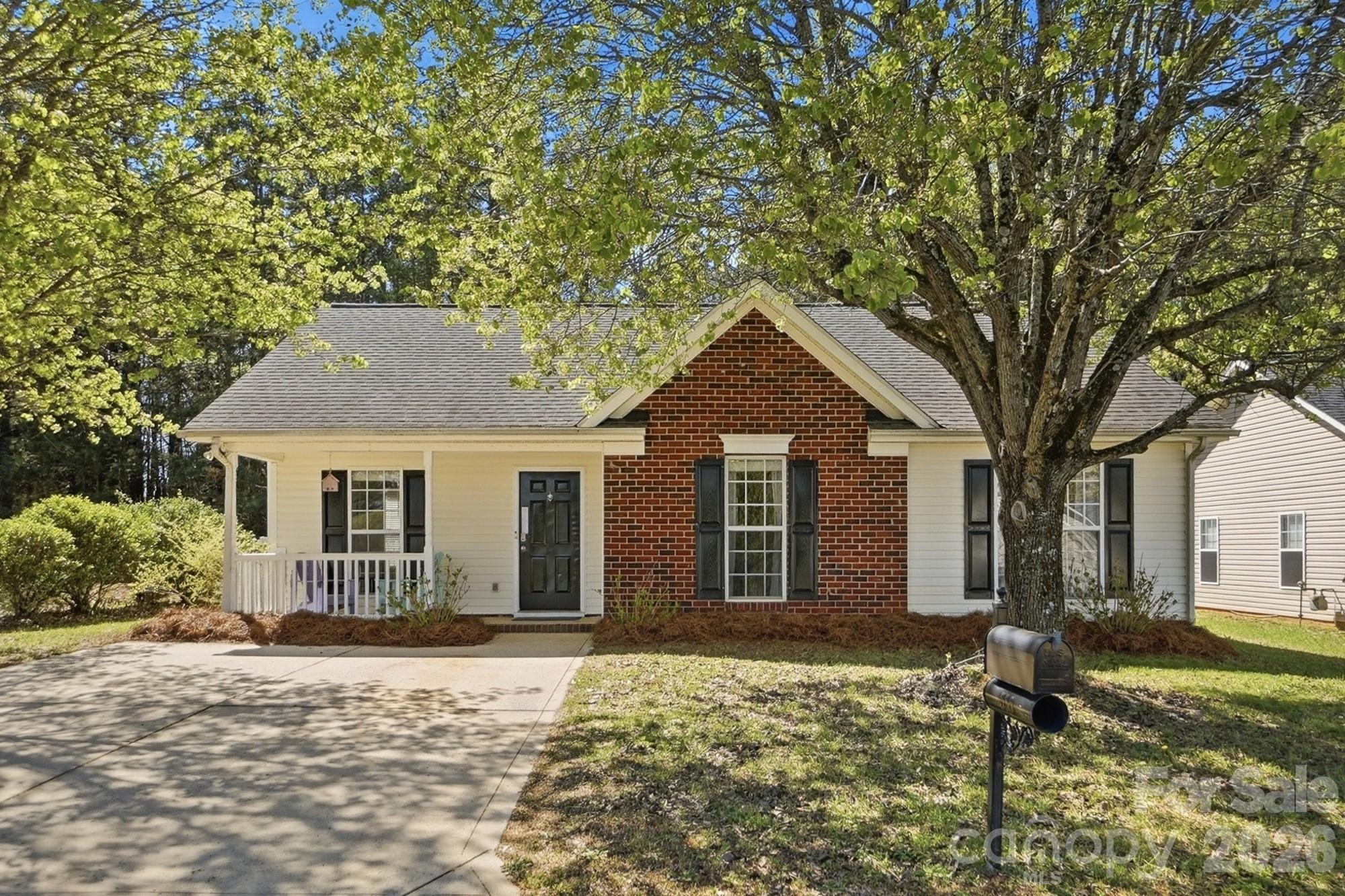 Welcome to 555 Annalinde Lane, where easy one-level living meets style, comfort, and just the right touch of personality. The inviting covered front porch greets you upon arrival, and once inside, the living room feels bright and airy, highlighted by a vaulted ceiling and a cozy fireplace with gas logs that beautifully anchors the space. The kitchen and bathrooms feature ceramic tile for durability and easy care, while plush carpet throughout the rest of the home adds warmth and comfort underfoot. The primary suite offers a completely different vibe, color-drenched in a rich, deep blue that creates a calming, retreat-like atmosphere, enhanced by custom mouldings and its own vaulted ceiling for added dimension and charm. Out back, the fenced yard is ready for pets, play, or peaceful evenings, offering a wonderful sense of privacy as it backs to trees. The freshly painted 12x20 deck is perfect for entertaining or unwinding at the end of the day, and a storage shed provides the extra space you need for tools and outdoor essentials. Enjoy neighborhood amenities including a clubhouse, pool, and playground, all while benefiting from low South Carolina taxes. Whether you're stepping into homeownership or simplifying your lifestyle, this inviting ranch delivers comfort, character, and a space that truly feels like home. Showings start Sat at 9am