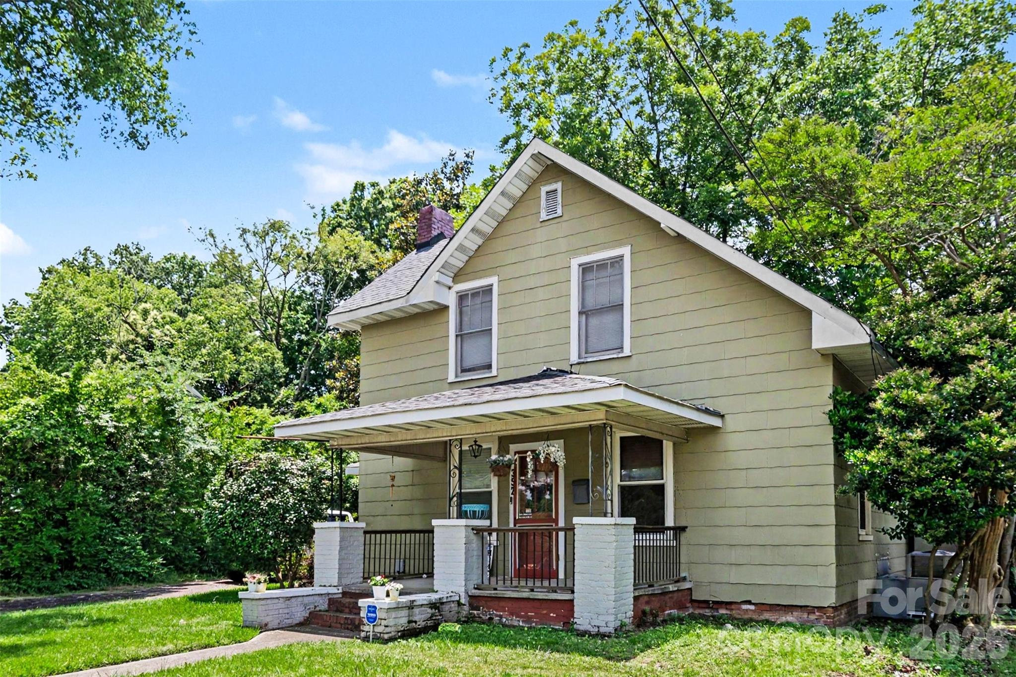Charming home just minutes from downtown Rock Hill, with easy access to breweries, restaurants, and retail. This 3-bedroom, 1.5-bath home features original character throughout, including crystal door knobs, original pine floors on the first floor, and multiple covered porches. The full bath was converted into a half-bath/laundry combo. Roof replaced in 2018 and downstairs AC ductwork was redone in 2026. Flooring has been updated in the kitchen, half-bath/laundry area, and primary bedroom. The backyard is a true retreat with a fully fenced yard, mature trees, a built-in firepit, and plenty of room to entertain, garden, or simply enjoy the outdoors. A portion of the fence has been recently updated. Don’t miss your chance to own a character-filled home in a convenient Rock Hill location — schedule your showing today!

Do NOT go near, touch, or attempt to interact with the black and white cat :)