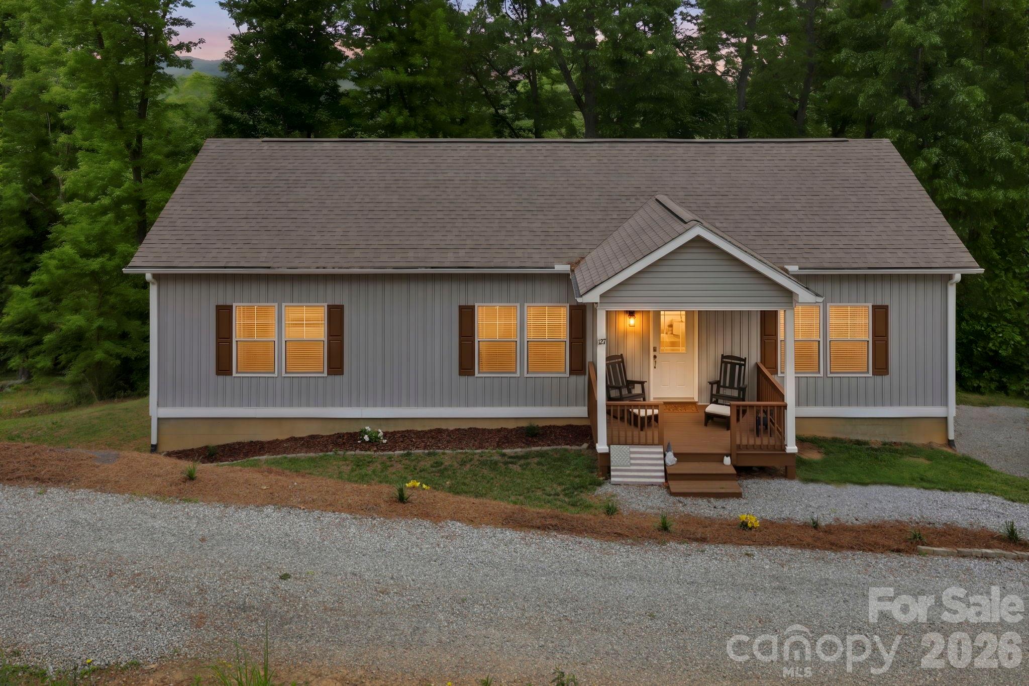 This beautiful 3 bedroom, 2 bath home offers the perfect blend of comfort and scenery. Featuring an inviting open floor plan, the spacious layout creates a seamless flow between the living, dining, and kitchen areas - ideal for everyday living and entertaining. Situated on 1.38 acres, you'll enjoy room to spread out while taking in stunning mountain views that provide a peaceful backdrop year round. Step outside onto the back deck, an ideal space for entertaining family and friends, enjoying outdoor dining or simply taking in the peaceful surroundings. Gather around the fire pit on cool evenings and enjoy the perfect setting for making memories under the stars. The home also includes a full unfinished basement, offering endless possibilities for storage, a workshop, recreation space or future expansion. This property combines space, functionality, and beautiful views to create a place you'll love calling home.