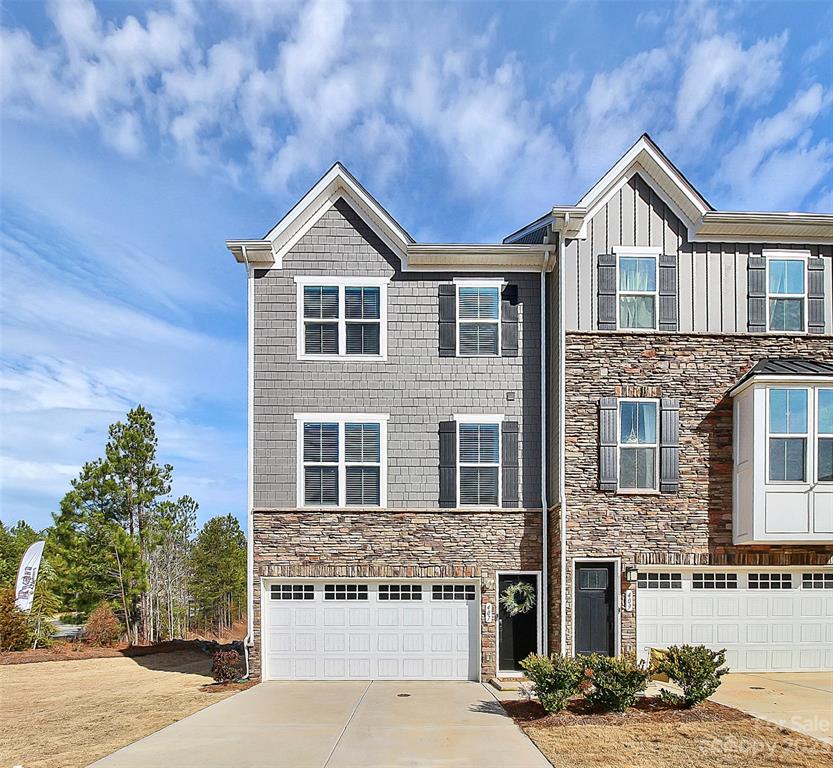 Highly desired Trinity Townes End Unit in Tega Cay. Like new construction, available Now! Why wait to build? Beautiful, well-kept home. A spacious, open floor plan. So many upgrades throughout! Enjoy a gourmet kitchen with an oversized quartz island, upgraded cabinets and SS GE Profile appliances and double ovens.Gas SS range. Upgraded doors and hardware, wood flooring on stairs and vinyl plank flooring on the main living area. 
Updated crystal-like chandeliers/ light fixtures. Trey ceiling in primary BR and tile shower. The Flex room can be used as an office, movie room, or fitness area. Either enjoy entertaining or relaxing on the deck and patio or take a stroll on the community walking trail. Great Fort Mill Schools. Low SC Taxes. Near shopping, restaurants, and Hwy 160 for very quick commutes to Charlotte and surrounding areas. Just a half mile away from Nevins Creek Landing; enjoy exclusive access to a private beach and all other Lake Wylie amenities such as Windjammer Park.