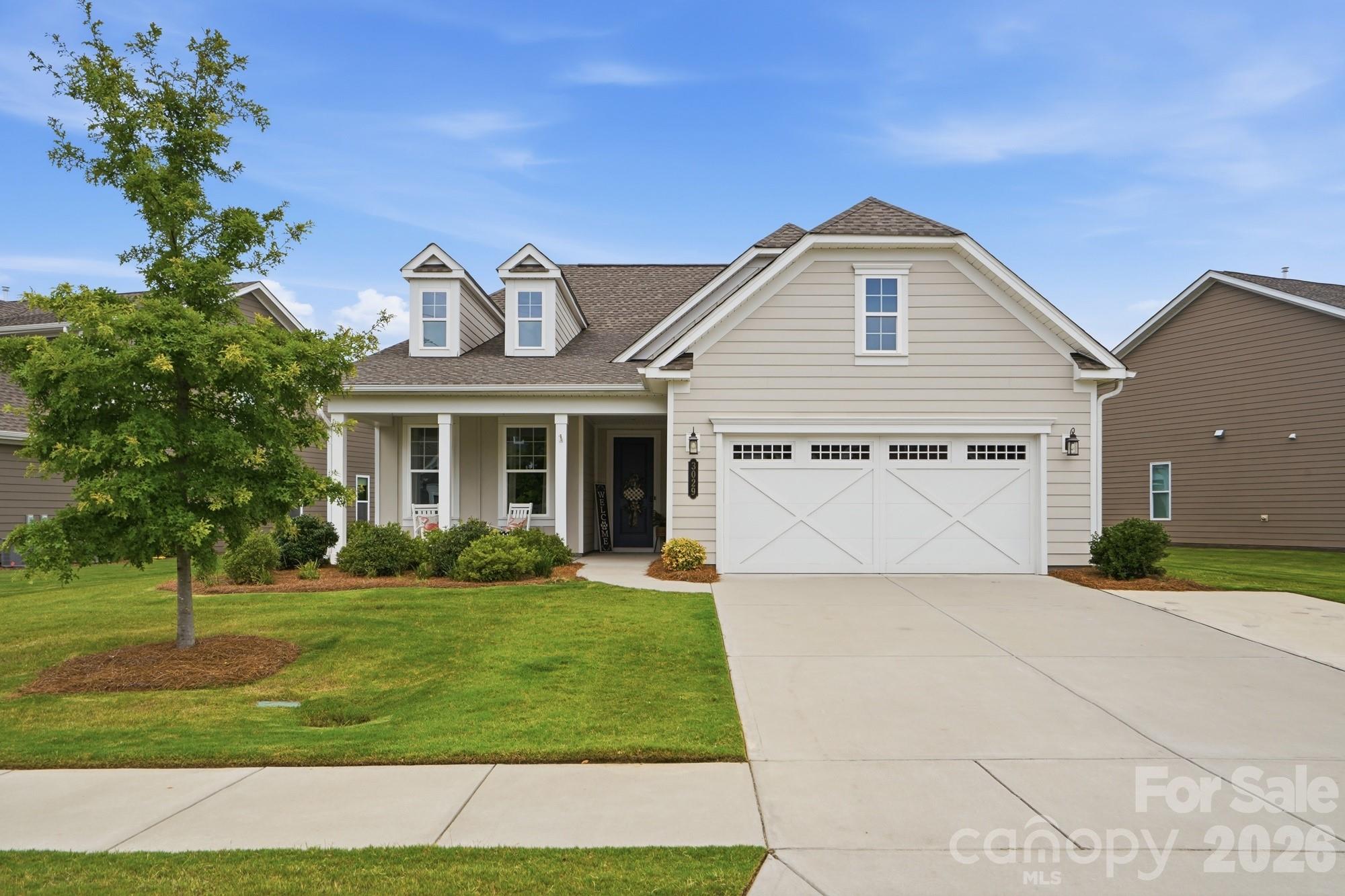 Beautifully upgraded home in the highly sought after 55+ active adult community, The Gentry at Handsmill on Lake Wylie, a gated neighborhood of 131 homes. This open-concept home features LVP flooring in the main living areas and new carpet and paint in the bedrooms. Additional upgrades include built-in illuminated office cabinetry, a custom accent wall, custom electric blinds, an expanded driveway and epoxy flooring in the garage and covered rear porch. The premium, oversized homesite backs into a wooded area, offering privacy and peaceful views. More than $5,000 in professional landscaping ads to the beauty of the yard.  Community amenities include a clubhouse, outdoor pool, fitness center, playground, outdoor fireplace, barbecue area, and numerous clubs for singles and couples and social activities.
