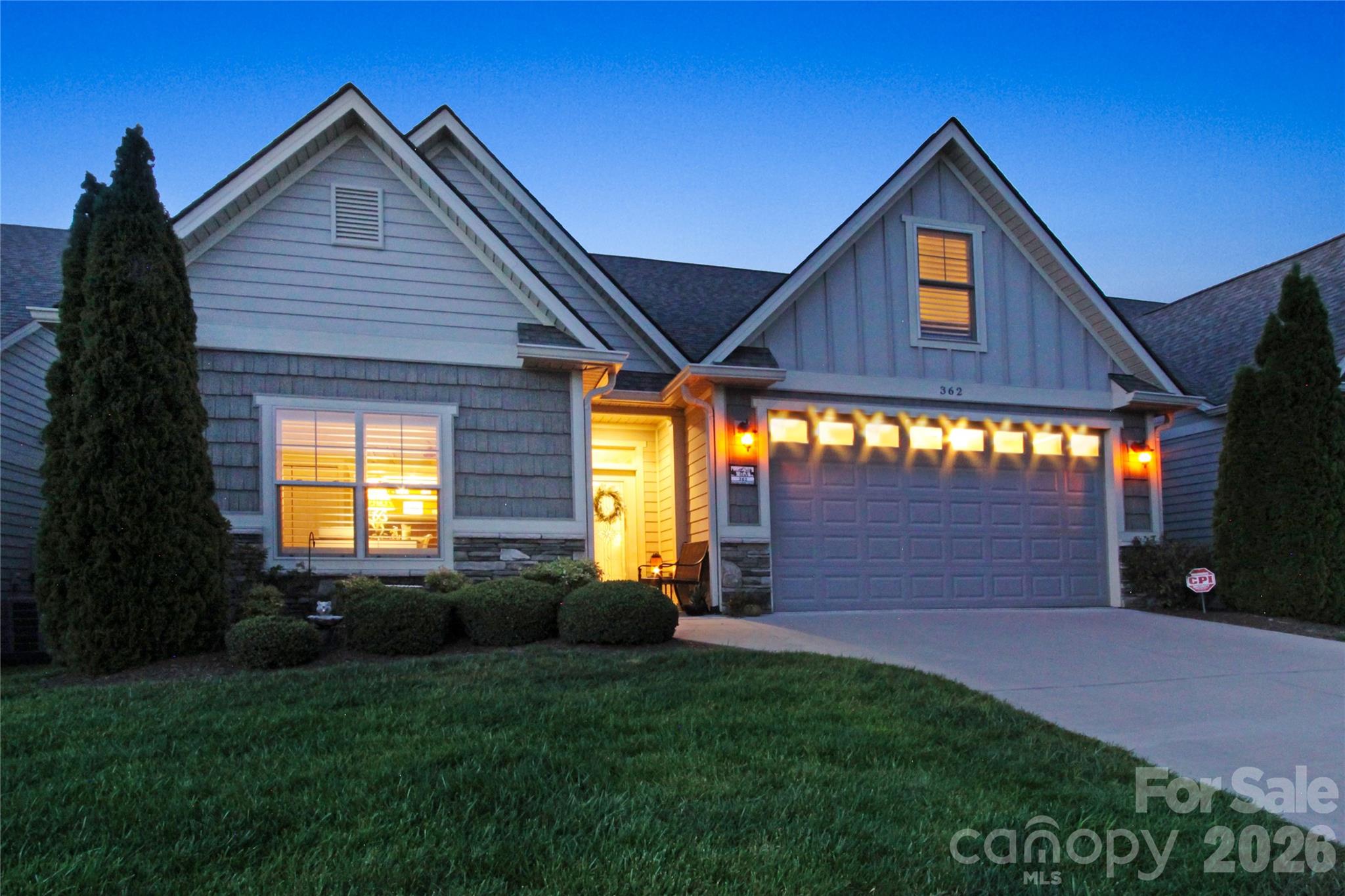Enjoy the convenience of main-level living in this beautifully maintained, free-standing townhome in the desirable Village at Windstone. With no shared walls, this home offers the feel of a single-family residence while providing the ease of low-maintenance townhome living.  For buyers seeking an effortless move, the home is available fully furnished, with only a few exclusions, through a separate bill of sale.

The open floor plan features a spacious living room with a vaulted tongue-and-groove ceiling, gas fireplace, and seamless flow into the dining area and kitchen. The main level also includes the primary suite, a second bedroom, a full bath, laundry room, and access to the covered rear patio.

Upstairs offers an additional bedroom with an ensuite bath, plus an additional bedroom that provides flexible space for a home office, media room, playroom, or hobbies.

Custom finishes include hickory hardwood flooring in the main living areas, granite countertops, stainless steel appliances, plantation shutters, crown molding, and decorative wainscoting. This property is fully equipped with a modern security system and a front-door surveillance camera.  An attached two-car garage provides additional storage and convenience. 

The Village at Windstone offers exterior building and yard maintenance, a seasonal outdoor pool, clubhouse, and on-site trash compactor. Convenient Fletcher location just minutes from shopping, dining, Asheville Regional Airport, I-26, Hendersonville, and South Asheville.