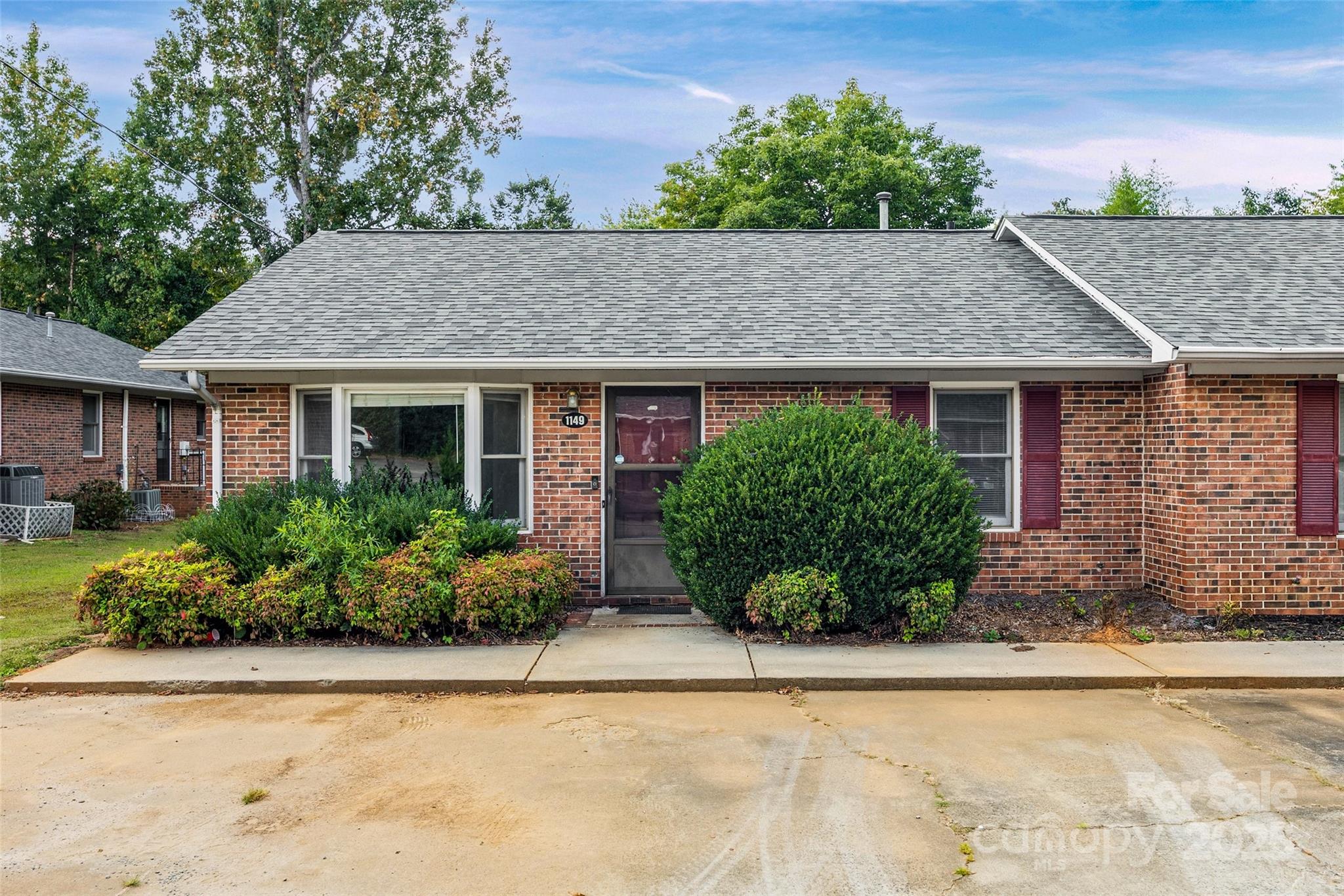 Welcome to this full brick condo in the desirable Cherry Farms community of Rock Hill! Perfectly positioned at the end of the subdivision, this home enjoys extra privacy and peaceful open green spaces surrounded by trees. The inviting floor plan offers a bright living room, cozy dining area, and a functional kitchen with plenty of cabinet space. Both bedrooms are spacious; the primary includes a walk-in closet and private half bath, while the secondary is ideal for guests or a home office. Enjoy the quiet, well-maintained community with low-maintenance living and unbeatable convenience. Located near Cherry Park, Miracle Park, shopping, dining and I-77, commuting to Charlotte or enjoying downtown Rock Hill, commuting is a breeze. Whether you’re a first-time buyer, looking to downsize or searching for a smart rental or investment opportunity, this condo offers the perfect blend of comfort and convenience. Don’t miss your chance to own in one of Rock Hill’s most desirable locations - schedule your showing today!