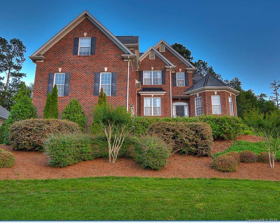 Overlook the water in this brick beauty. Beyond the front door are hardwood floors, soaring ceilings & cozy stone fireplace. Cherry cabinets & granite counters have so much storage. Master on the main features a large bay window and walk-in closet. Upstairs, 3 bedrooms with walk-ins as well as loft space provide room for everyone to enjoy. One bedroom is currently used as a theater room with surround sound. Keep having fun outside with a private fenced yard, full landscaping, and composite deck.