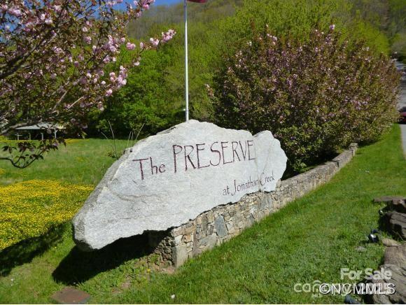 End of cul-de-sac privacy w/rough grade homesite on 2.8 acs [3 lots] located inside city limits of Maggie Valley.  Lot 22 has shared well, sewer. & long range mtn views with tree trimming/cutting. Only 1 home on Lot 21 & 22, with guest home allowed on Lot 24 w/potential driveway access from Lot 22 or off Prestige Pt.  $810 sewer tap fee per Br - $5,000 tap fee paid to owner of Lot 23 if buyer connects guest home built on Lot 24.  1200 SF w/720 SF on main level minimum restriction. Garage and paved driveway restrictions potentially waived upon request to HOA since other subd lots do not have garage or paved driveway.  1 Short term rental currently allowed per lot. 18 ft wide paved subd streets - UG elec - some street lights & split-rail fencing - Skyrunner high speed internet available.  $500 road impact fee/lot paid to HOA prior to grading w/$100 HOA app fee paid at closing.  Subd located within 10-13 min to Maggie Valley, Waynesville & Lake Junaluska.  Listing Agent related to Seller.