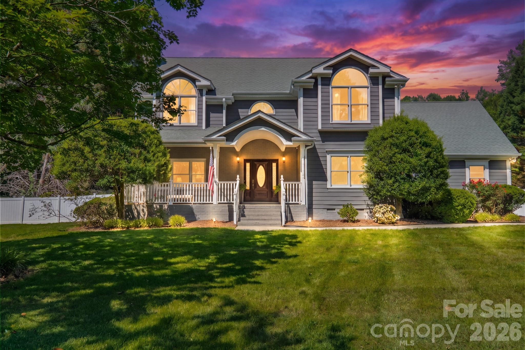 Tucked away on a private 1.74-acre homesite in the sought-after Cobblestone neighborhood, this quintessential Weddington property delivers the lifestyle buyers dream about. Surrounded by mature trees and zoned for the top-performing Weddington schools, this special property offers privacy, charm, and incredible outdoor living, all just minutes from schools, shopping, dining, and major employment centers.
The backyard is a showstopper. Resort-style living comes to life with a saltwater pool with newer liner, dramatic boulder steps leading to the expansive pavilion featuring a linear fireplace, vaulted tongue-and-groove cedar ceilings, and cedar posts. The pool house adds exceptional flexibility with a flex space and full bath, creating the perfect retreat for entertaining, relaxing, or hosting overnight guests.
Inside, light-filled interiors and hardwood flooring throughout most main living areas and bedrooms create a warm and inviting feel. The family room with custom built-ins opens seamlessly to the updated kitchen and breakfast area, complete with white cabinetry, granite countertops, and a stylish tile backsplash. The refined dining room is ideal for entertaining, while the inviting flex space anchored by a gas fireplace offers exceptional versatility for a lounge, study, or additional living area. The main-level bedroom with full bath add versatility for today’s lifestyle.
Upstairs, the spacious primary suite features vaulted ceilings, tranquil views of the grounds, and an ensuite bath. Generous secondary bedrooms, updated shared bath, and bonus room complete the upper level.
Two-car side-load garage, long driveway approach, and an unbeatable Weddington location make this a rare opportunity not to be missed.