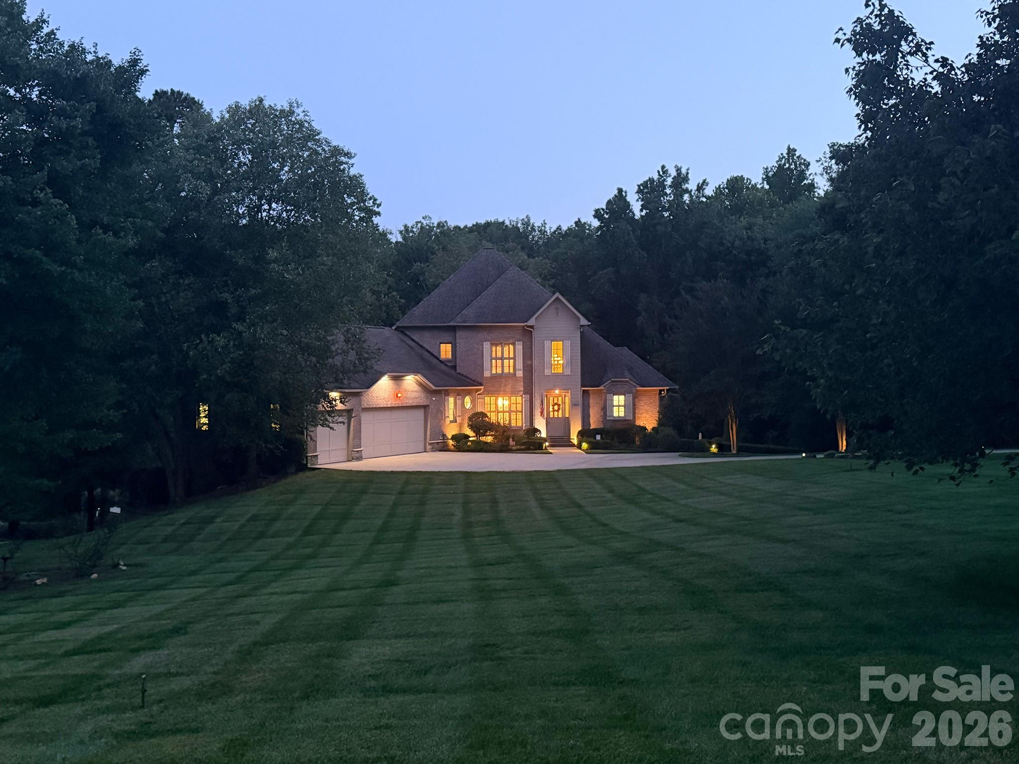 This exceptional 5,200+ square-foot waterfront residence offers an unparalleled blend of luxury, privacy, and Lake Norman living. Enjoy your own dock, private sandy beach, pool, hot tub and park like setting in your own backyard.
Meticulously maintained and filled with natural light, the home offers generous living spaces, quality finishes, and a floor plan that seamlessly connects indoor and outdoor living. 
Thoughtfully designed for both everyday comfort and grand entertaining, the home features 4 spacious bedrooms, 4 full baths, and a highly sought-after primary suite on the main level. Primary on the main overlooks pool w/lake view. Master bath w/jetted tub & tiled shower (dual & overhead shower system). Lake level walk out basement media room, wet bar with sink & refrigeration. Maintain fitness goals in exercise room with views of the hot tub that waterfalls into pool. Lake fed irrigation system. low voltage exterior lighting showcases home and landscaping.