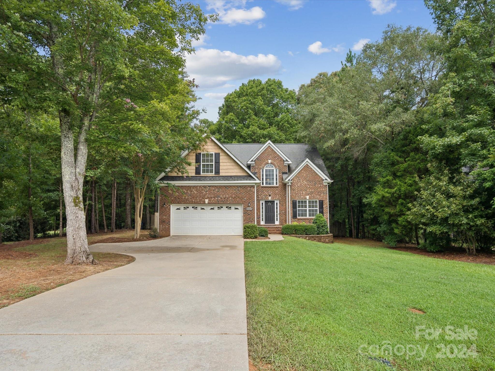 Welcome to this charming home settled on a Large private fenced in wooded lot. Stunning finishings and work done by a custom professional contractor. Elevation has partial brick and gorgeous professional landscaped entrance. The owner wanted the home perfect for you so they freshly painted the whole house and added brand new carpet with an 8 lb pad. Enter this beauty and you are greeted by a beautiful staircase and a grand 2 story foyer w/ hardwoods throughout. Open floor plan is perfect for entertaining with fully equipped kitchen w/ Granite counters and SS appliances that leads to a Dining Room and Breakfast area. Great Room has dramatic cathedral ceiling and cozy brick fireplace. Spacious Primary suite w/ Full Bath on the main. 3 additional bedrooms and spacious full bath (1 of the bedrooms can be a Bonus Room it is HUGE)  Loft area for office/Payroom or movie night. Outdoor Living Features large covered deck overlooking tree lined backyard. Pristine Home and Impeccable Homesite!