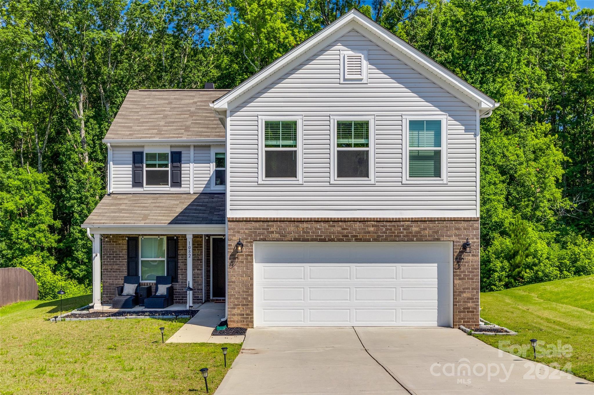 This like-new home, built in 2021 is move-in ready! Downstairs features an open floorplan with home office.  Living room has a fantastically framed wood-burning fireplace, and spacious eat-in kitchen with upgrades from the tile backsplash to the granite countertops. Upstairs you will find a spacious loft. Sizable bedrooms boast plenty of storage space, especially the primary suite with TWO walk-in closets. Additional home features include massive driveway and two car garage with plenty of room for additional storage. Bask in the peace of your back patio with wooded views. Come check out this beauty today! ELIGIBLE FOR UP TO $7500 IN LENDER CREDITS FOR QUALIFIED BUYERS THAT ELECT TO USE PREFERRED LENDER!