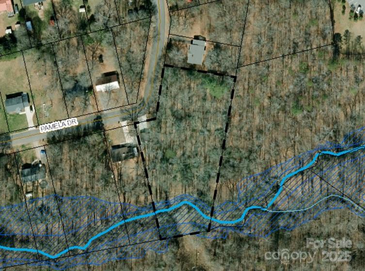LARGE buildable lot (that could be divided into two or three) in established residential neighborhood in the heart of Shelby...just minutes from Hwy 74 business corridor and Uptown Shelby! Encroachment by neighbor--driveway and outbuilding appear to be on this property.  Creek runs along back of property and is in a flood zone, but there is buildable area at the street that does not interfere with flood zone. All questions about buildability should be confirmed by buyer. Three additional parcels available on Pamela Drive (MLS# 4251974, 4251986, 4251989). City of Shelby provides water, electricity, gas, trash, sewer, and water (all tap fees required). Deed references an old right of way with Southern Bell from 1948. No recent survey.