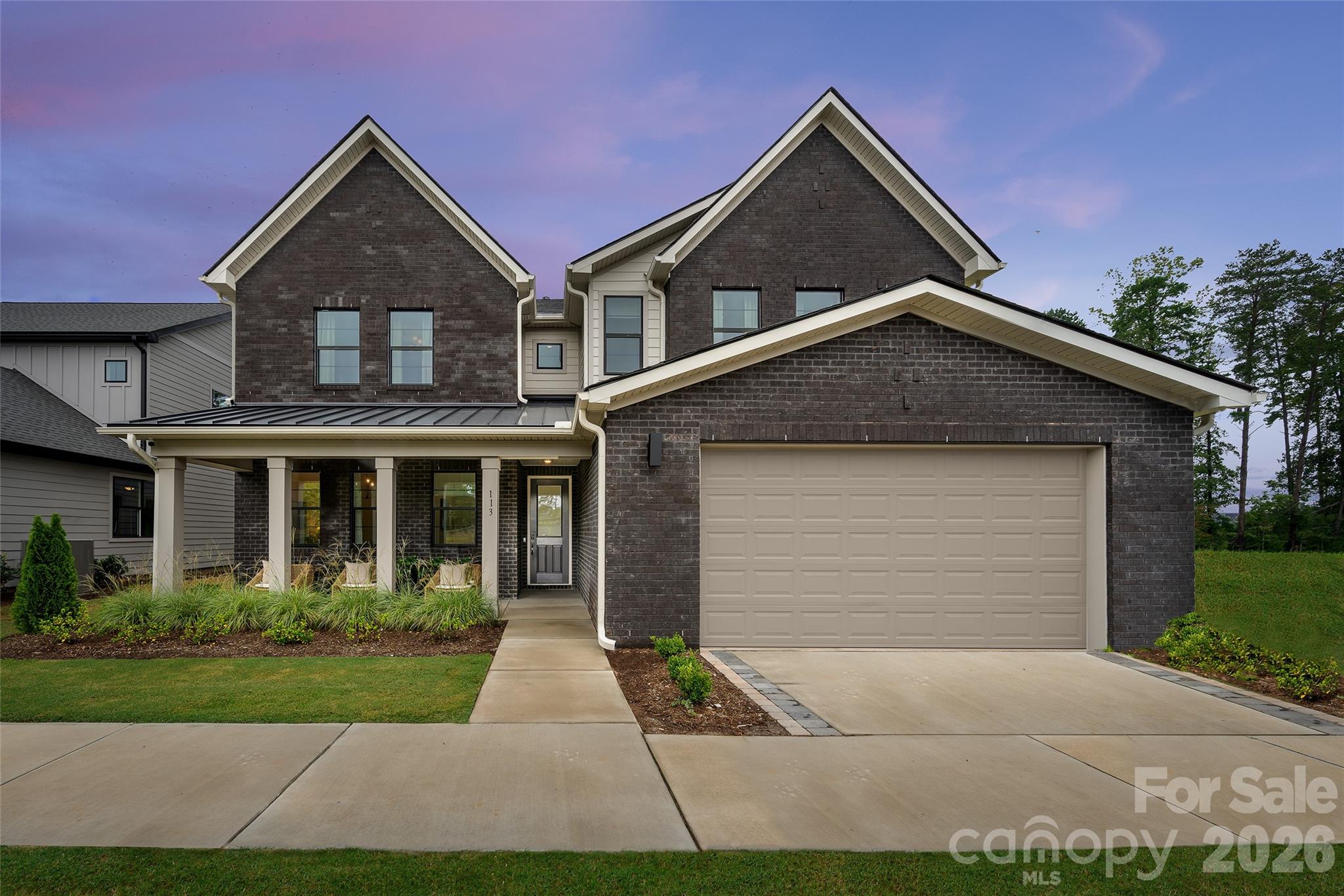 Own the Logan Model Home—Windell Woods’ Best-Selling Floorplan and the ultimate showcase of luxury living! This professionally decorated model home is loaded with premium upgrades and designer-selected finishes throughout. The chef-inspired kitchen features top-of-the-line Whirlpool gas appliances, including a 36" gas cooktop, wall microwave/oven combo, under-cabinet hood, dual dishwashers, and a KitchenAid counter-depth French door refrigerator, all complemented by upgraded cabinetry, quartz countertops, tile backsplash, and under-cabinet lighting. Expansive living spaces include a dramatic 12' rolling wall of glass at the dining area, a gas fireplace in the great room, and a striking electric fireplace in the flex space. The luxurious primary suite offers private deck access and a spa-inspired bath with a freestanding soaking tub and oversized shower. Additional highlights include a 4' garage extension, upgraded hard-surface flooring, tile in all baths and the laundry room, and included washer and dryer. Step outside to enjoy an extended covered patio, custom firepit, and extensive professional landscaping designed for year-round enjoyment. Complete with all designer lighting, fans, and model-home finishes, this is a rare opportunity to own the community’s most popular plan in its most spectacular form. Schedule your private tour today and experience the exceptional lifestyle that only the Logan Model Home can offer!