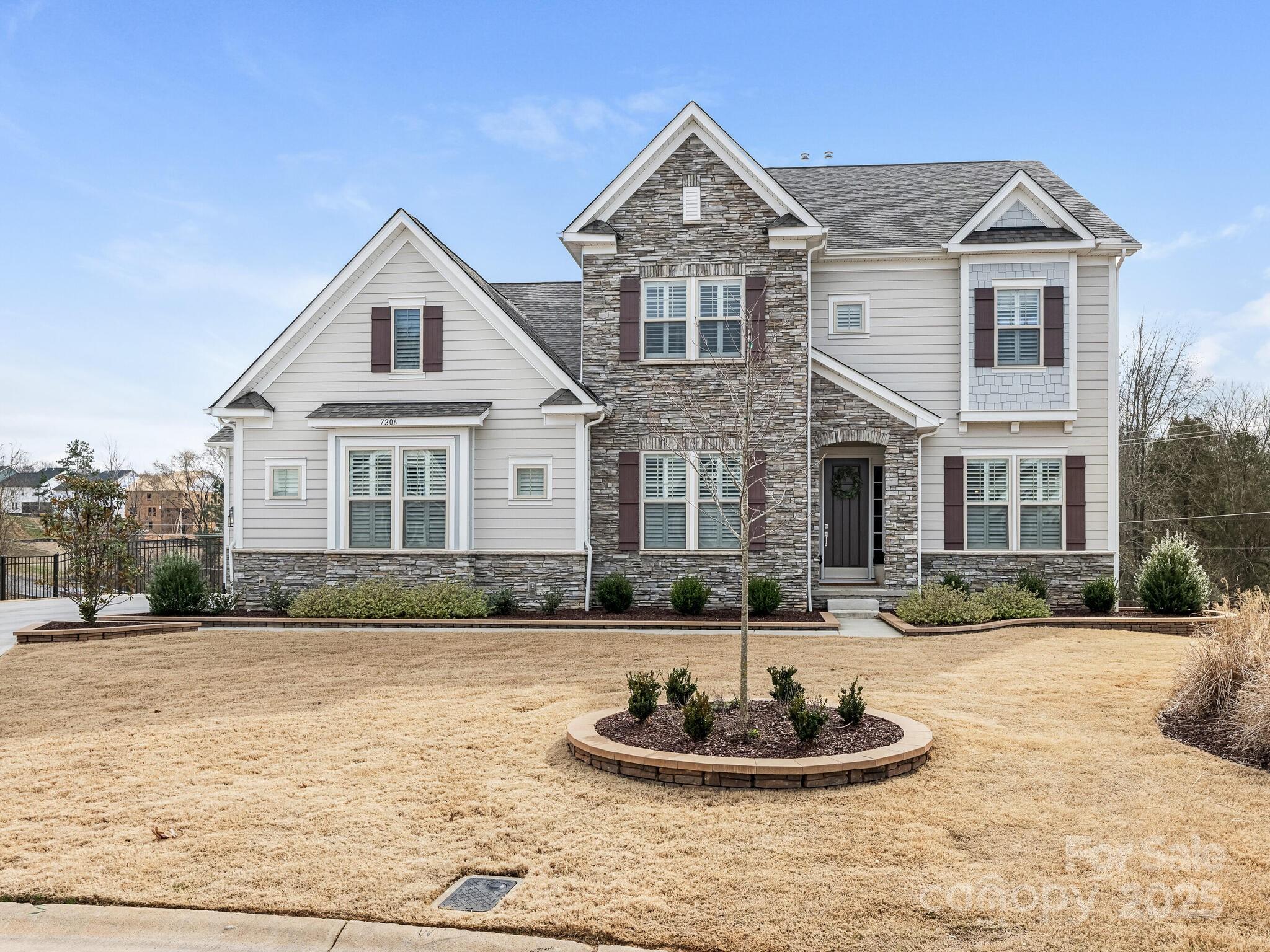 Just as stunning as it looks in photos! Nearly new 2 story Inverness plan with walk out finished basement and recently completed heated saltwater pool on wide cul-de-sac lot. This 5 bedroom, 4.5 bath home features over 5200 sq ft with attention to detail throughout the home. Its combination of warmth and luxury is exactly right. Fenced yard, 3 car garage, primary bedroom on the main floor. Vaulted foyer and 10' ceilings on main floor let in light throughout the day. Quartz counters, walk in pantry, 36" gas cooktop, water filtration. Breakfast area opens to screen porch. Secondary bedrooms have all been professionally decorated and bonus room upstairs is great for entertainment. Don't miss the lower level rec room, bedroom 5 and SO MUCH STORAGE! It will be hard to select your favorite part of this home! Convenient and fast growing Indian Land location, just south of Ballantyne and only 1 mile from NC/SC line. Call for your showing in the Estates of Covington today!