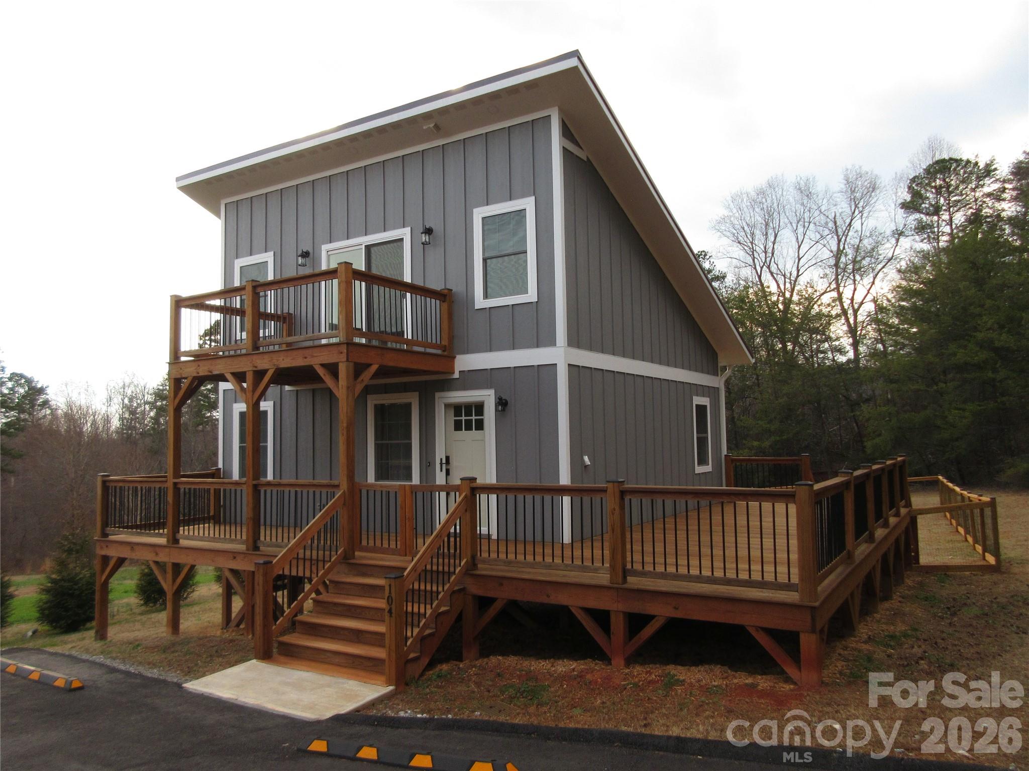 Beautiful new construction home on STILTS!! This 2 bedroom/1.5 bath home is conveniently located and move in ready.  Partially furnished, this home has granite countertops, stainless steel appliances, hardwood floors, large decks, fenced back yard, etc...  Whether looking to downsize or just getting started, this is a must see home!
