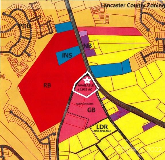 Excellent high traffic location and a traffic light.  Property fronts 3 highways - US Hwy 521, Van Wyck and Charles Pettus.  County water and sewer nearby.  There is an older home on the property at no value. ** 2 adjacent parcels of 20+/- acres could be sold in addition.