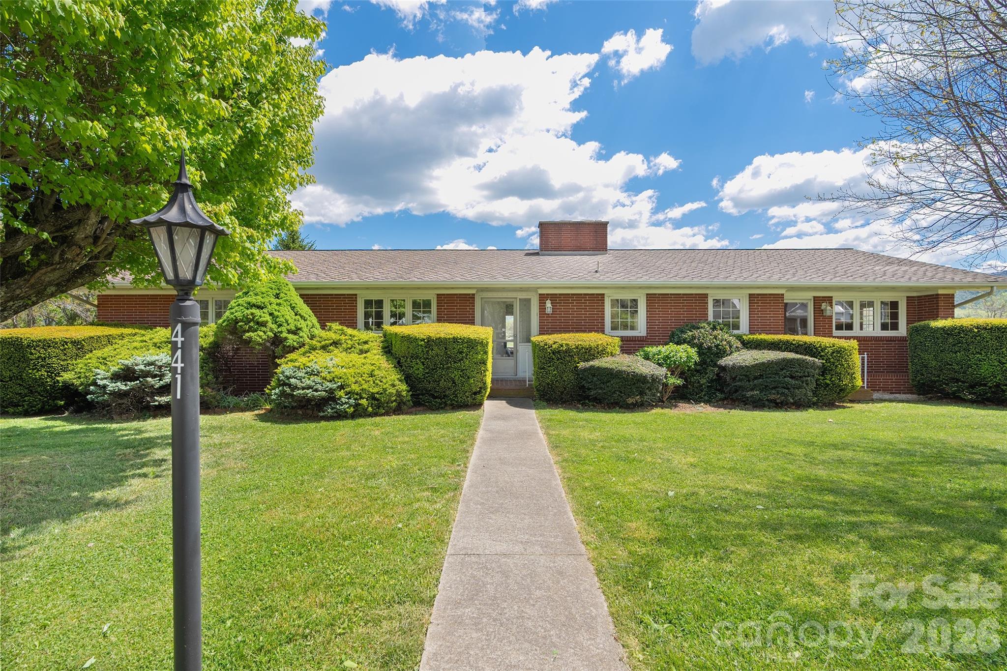 This beautifully updated ranch-style home in the desirable Mulberry Street neighborhood in Clyde offers the perfect blend of comfort, style, and convenience. Situated on 0.39 acres, the property provides easy access to I-40 and Highway 19/23, making shopping, dining, and everyday essentials just minutes away! The main level features  thoughtfully updated, move-in-ready living space. Inside, you’ll find 3BD/2BA, along with a formal living room featuring a gorgeous fireplace, a dining area, and a spacious family room! The kitchen offers great functionality and flow, ideal for both daily living and entertaining. Step out from the family room onto the expansive TimberTech deck, where you can relax and take in beautiful views of the surrounding pastures and mountains.  The lower level adds additional square feet and offers a versatile walkout, daylight basement complete with a flex/bonus room, laundry area and a rec room featuring a fireplace that opens to a charming patio, creating even more outdoor living space to enjoy the peaceful setting. An oversized garage with ample space for a workshop or additional storage completes the lower level!  Meticulously maintained and thoughtfully updated throughout, this home offers modern appeal, flexible living spaces, scenic views, and an unbeatable location. Don’t miss this exceptional opportunity!