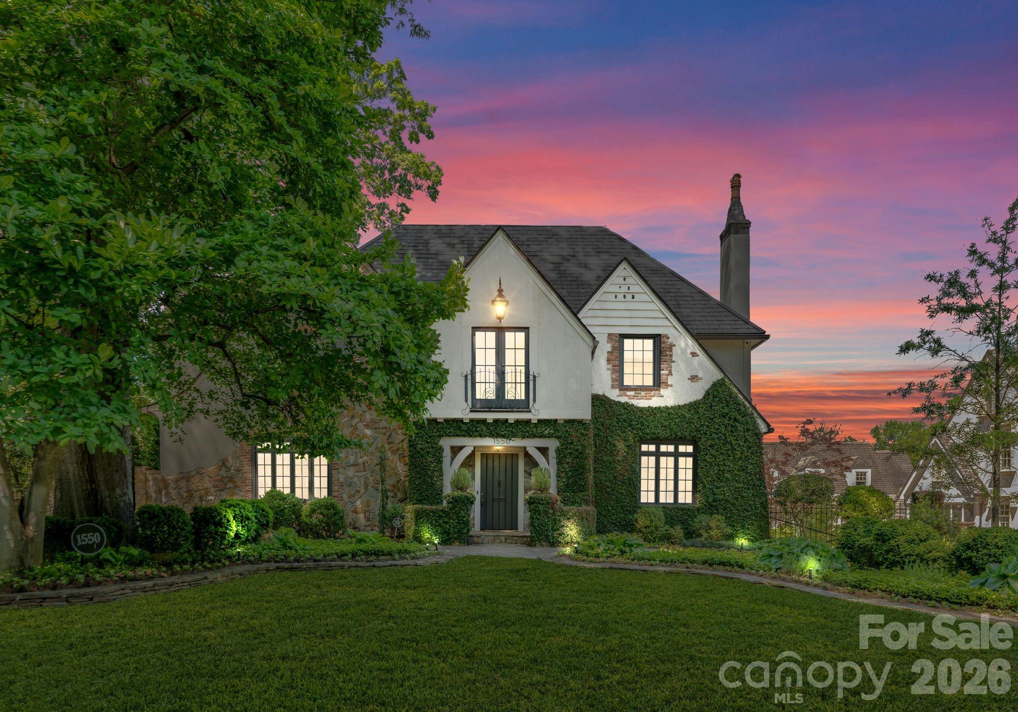 Experience timeless elegance at this distinguished Tudor residence on the renowned Queens Rd. W in prestigious Myers Park neighborhood. This exquisite home marries classic charm with contemporary sophistication, offering the perfect balance of luxury and comfort. With its' warm formal areas and open-concept kitchen and family room, this home is perfect for intimate gatherings and daily living. Upper level features primary suite and three additional bedrooms, each with en-suite baths, ensuring privacy and convenience.  A versatile bedroom on the main level and another on the basement level, both with en-suite baths, offer flexibility for family or guests.  Meticulous renovations adorn every surface, refelcting an unwavering attention to detail. Outside, the property transforms into a private sanctuary, where lush, mature landscaping and elegant bluestone decking embrace the serene saltwater pool and spa. This tranquil oasis offers a retreat of unparalleled peace and refinement.