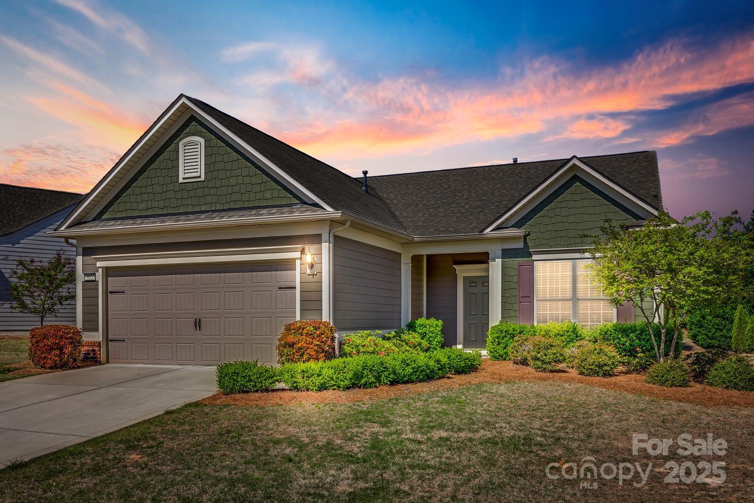 Welcome to this beautiful Martin Ray model in the amenity-rich neighborhood of Carolina Orchards (55+). Entertain with ease in this open floor plan. Kitchen has stainless steel appliances, granite countertops, cabinets with soft close drawers/doors, oversized island, butler's pantry & walk-in pantry. The Kitchen opens to a spacious Dining Area and oversized Living Room. Primary Suite overlooks a large common-area and features a large closet, linen closet and spa-like bathroom with a huge walk-in shower, double sinks and granite countertops. So much space in this home: 2nd and 3rd Bedroom, Full Bath with tub and granite countertops, Office, spacious Laundry Room, Drop Zone, and many closets! Enjoy the outdoors on your screened-in patio and private back yard.