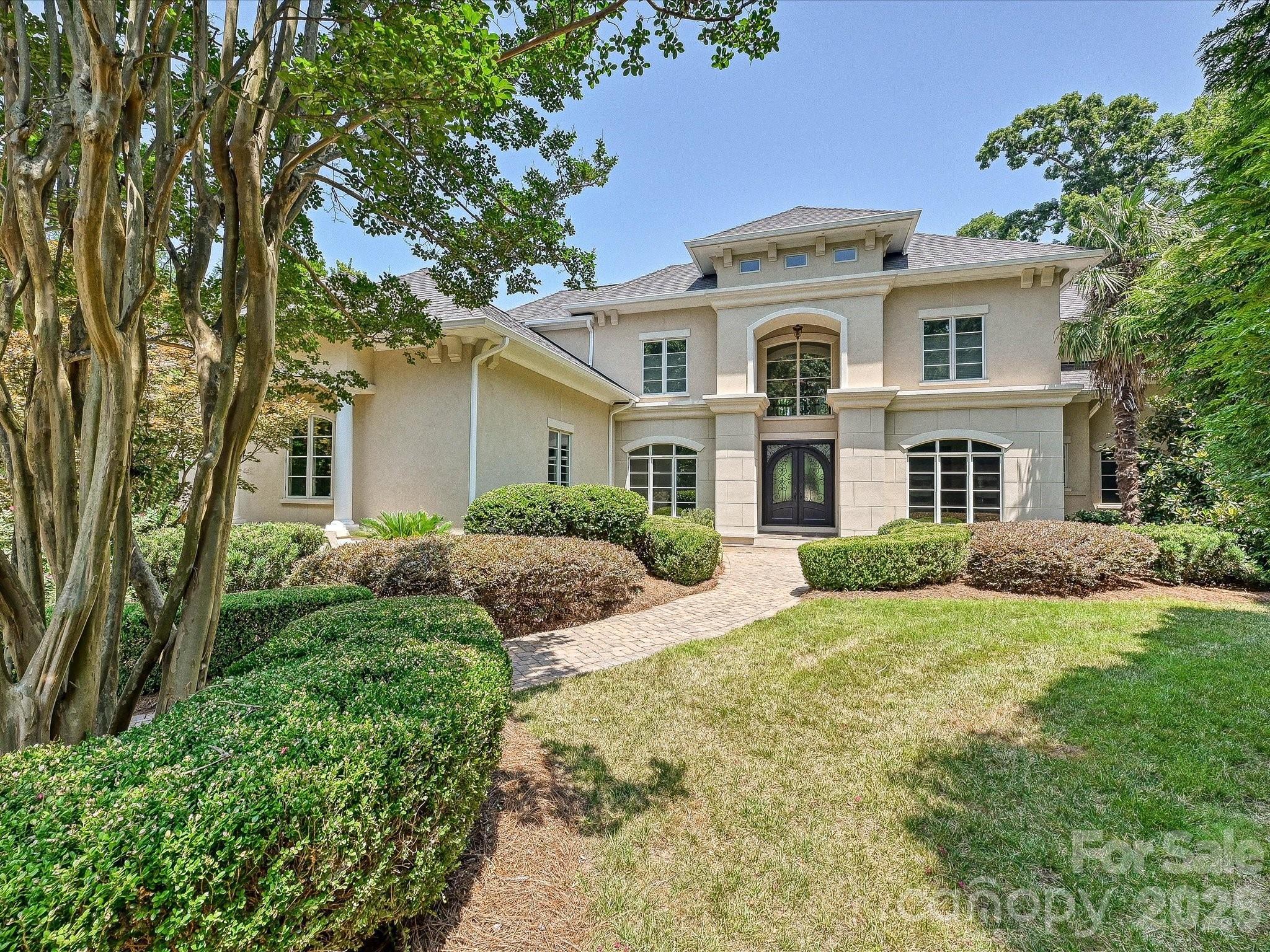 Gorgeous, extraordinary luxury estate in Ballantyne Country Club. This special home offers timeless elegance, exceptional craftsmanship, privacy, and effortless luxury in one of the most desirable neighborhoods in Charlotte. Designed for both grand entertaining and everyday living, this home offers a striking floor plan with stunning architecture, resort-style pool area & hot tub, expansive outdoor living, and a beautifully updated interior. New carpet, freshly painted interior & exterior, pool & hot tub w/new pool cool decking, and updated cabinetry. Beautiful kitchen & breakfast areas, stunning great room & family areas, and a beautiful primary suite w/tray ceilings, dual walk-in shower, huge closet, and tray ceilings. The upper level offers 3 large bedrooms & baths, work station areas, and flex rooms.  Generous finished basement w/bar, large recreation rooms, extra pool bathroom, guest suite, exercise room and walk-in storage.  Arched entryways, screened porch, huge storage areas, 3 beautiful fireplaces & 3 car garage (1+2).  Perfectly situated on a large, private, beautifully landscaped cul-de-sac lot, this remarkable home offers one of Charlotte's finest luxury lifestyles in one of its most sought-after communities.