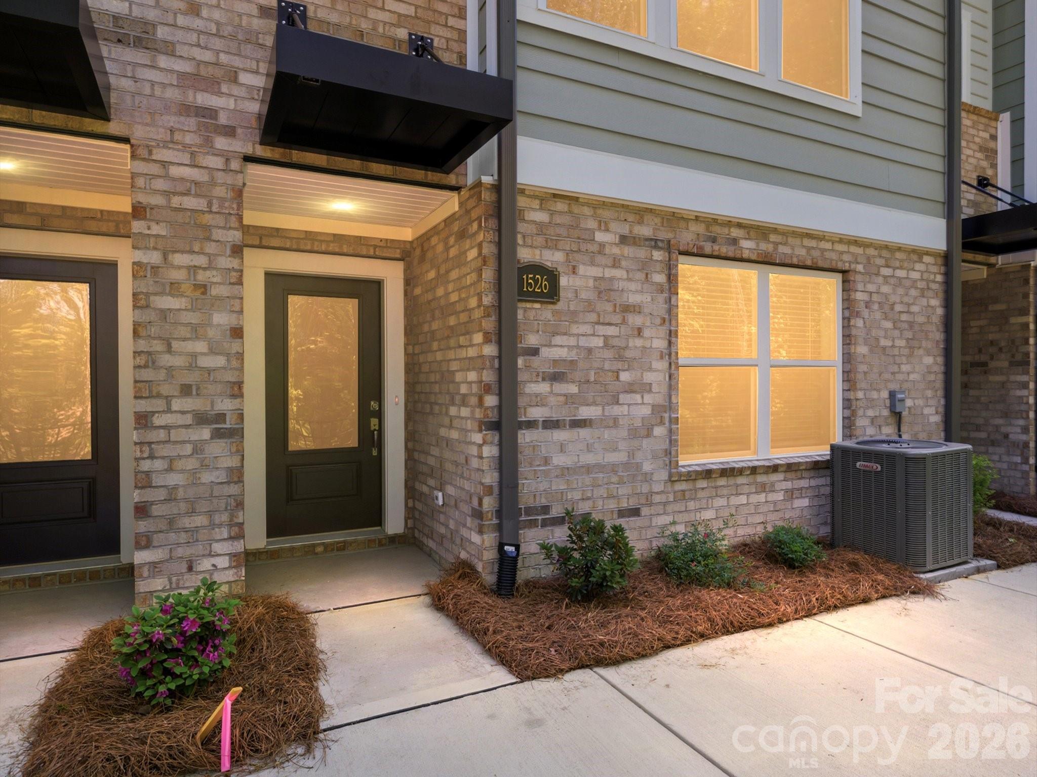 Discover this stunning 3-bed, 3-bath townhome, perfectly positioned on a prime tree-lined homesite with wooded views. Enjoy elevated living with a spacious balcony, 9-foot ceilings, and an expansive kitchen island ideal for entertaining. Ground level suite perfect for guests with direct bath access.  Designed for comfort and efficiency, this home features energy-saving construction, luxury vinyl plank flooring, and signature David Weekley oversized windows that fill every room with natural light. The kitchen is beautifully appointed with Frigidaire Gallery appliances, blending style and performance in every detail.