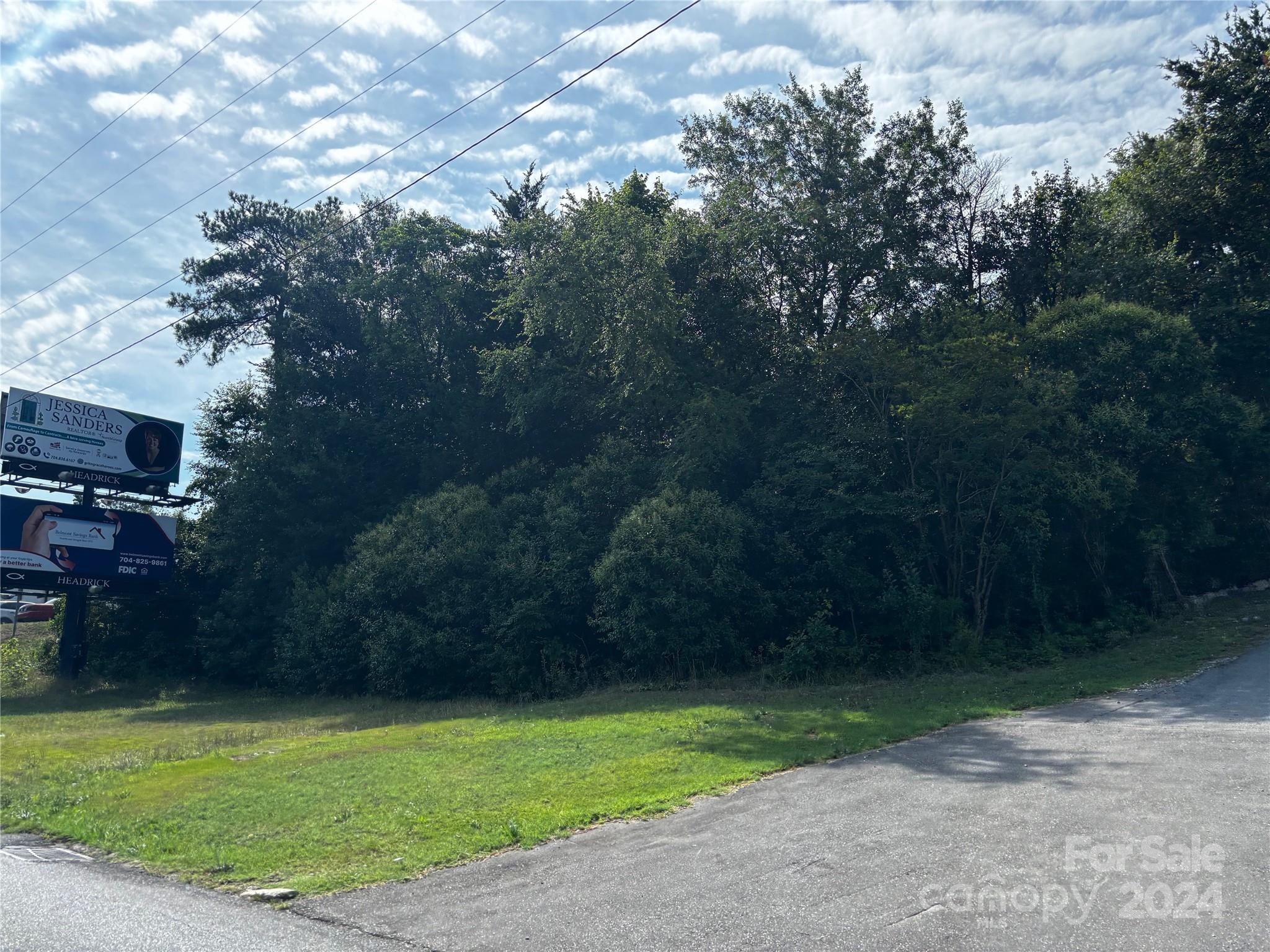 Highly Visible Location On Wilkinson Blvd In Belmont and very close to Cramerton, Prime Commercial spot,
 
2 Lots,  6022 W Wilkinson fronts Wilkinson Blvd and adjoining lot is Orchard Ln, 

Orchard Ln PID 185932 Zoned R-R,  

6022 Wilkinson Blvd PID 185927 Zoned H-C, 

Buyer to verify Use, Zoning, Water, Sewer, and Building guidelines, 

There is a billboard on 6022 Wilkinson parcel