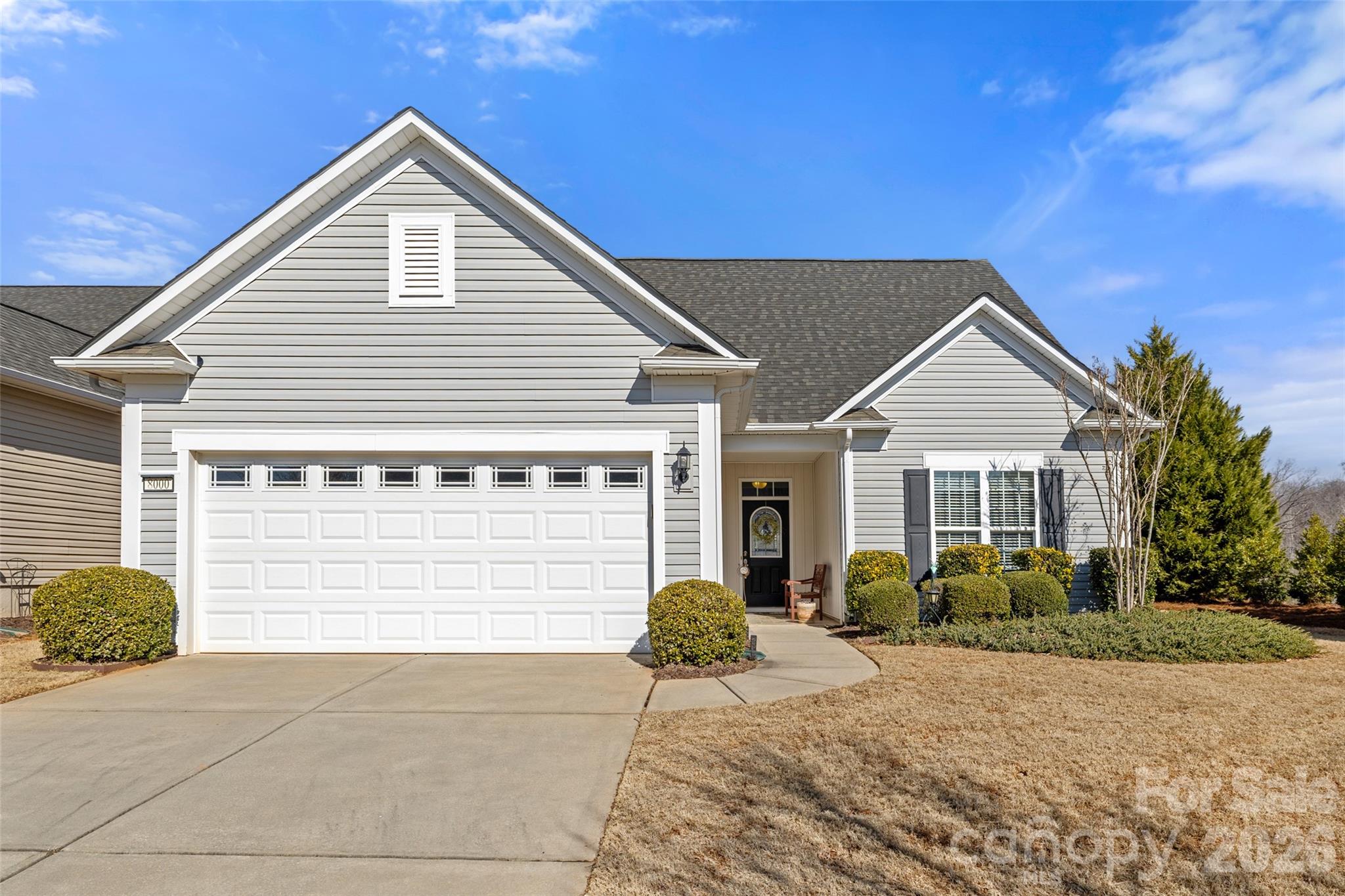 Nestled on a private corner lot in the heart of Sun City Carolina Lakes, this beautifully maintained Copper Ridge with loft offers a flexible floor plan and thoughtful upgrades throughout. The inviting foyer opens to an airy living space with a vaulted ceiling, abundant natural light, and ceiling fans that add both style and comfort. The primary bedroom, bath, and guest room are freshly painted, offering a neutral palette! Enjoy cool evenings by the light of the gas fireplace in the living space. The gourmet kitchen is designed for everyday living and entertaining, featuring granite countertops, stainless steel appliances, gas cooking, ample cabinetry with roll outs, and a spacious layout that flows seamlessly into the main living area.

The primary suite is privately situated on the main level and includes a generous walk-in closet and a well-appointed bath. Additional main level spaces include a guest bedroom, full bath, office or flex room, and a convenient laundry room with cabinetry, shelving, and washer and dryer that convey. Upstairs, the loft provides valuable additional living space ideal for guests, hobbies, or a second living area, along with a bedroom and full bath that create a comfortable retreat for visitors.

Outdoor living is just as appealing, with a stamped concrete patio and plumbed gas line for the Weber gas grill that conveys, ideal for relaxed outdoor dining and enjoying the Carolina seasons. The garage features an epoxy floor, utility sink, surge protector, and expansion tank added to the water heater, reflecting the care and attention given to this home. Retractable awning, privacy planting, custom framed mirrors, and under cabinet spice storage add functional touches that elevate daily living.

Located in one of the Carolinas’ premier active adult communities, residents enjoy world class amenities including golf, pools, fitness centers, walking trails, clubs, and social activities, all just minutes from shopping, dining, and medical care. This Copper Ridge with loft offers comfort, flexibility, and the easy living Sun City Carolina Lakes is known for.